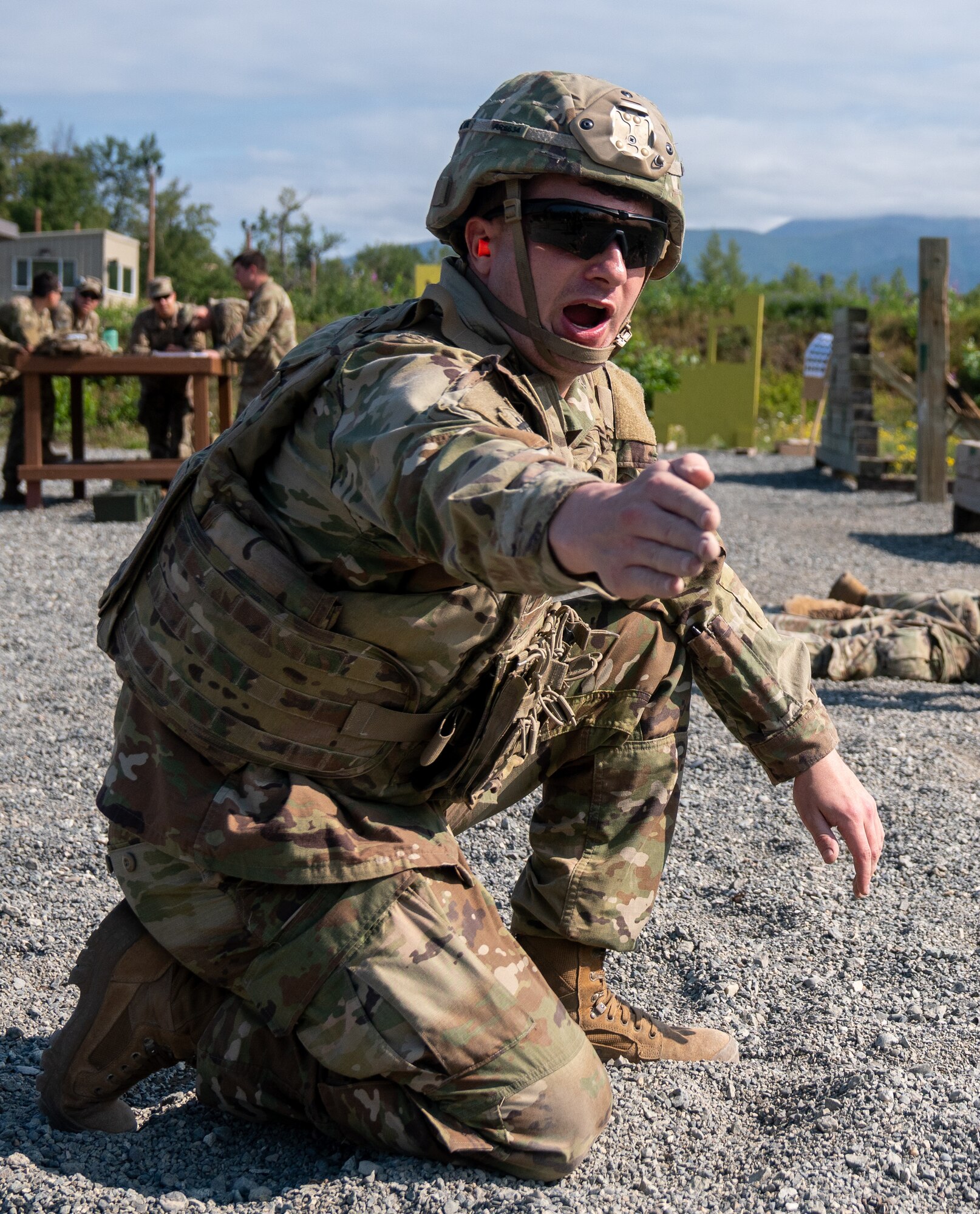 U.S. Army Sgt. Alexander Russo, a combat engineer assigned to the 6th Brigade Engineer Battalion (Airborne), 4th Infantry Brigade Combat Team (Airborne), 25th Infantry Division, U.S. Army Alaska, directs the fire of M240B machine guns while conducting live-fire training.