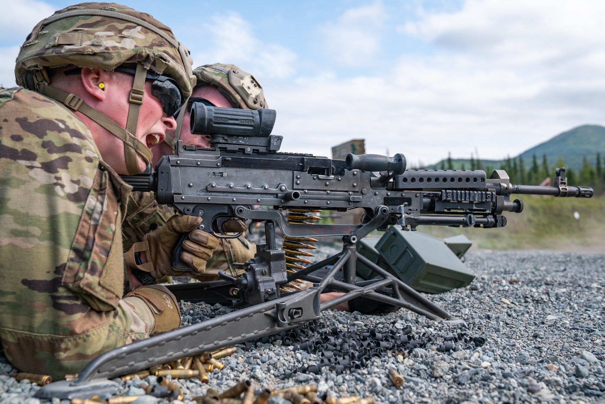 U.S. Army Pvt. Charles Becker and Spc. Trevor Tate, combat engineers assigned to the 6th Brigade Engineer Battalion (Airborne), 4th Infantry Brigade Combat Team (Airborne), 25th Infantry Division, U.S. Army Alaska, fire an M240B machine gun while conducting live-fire training.