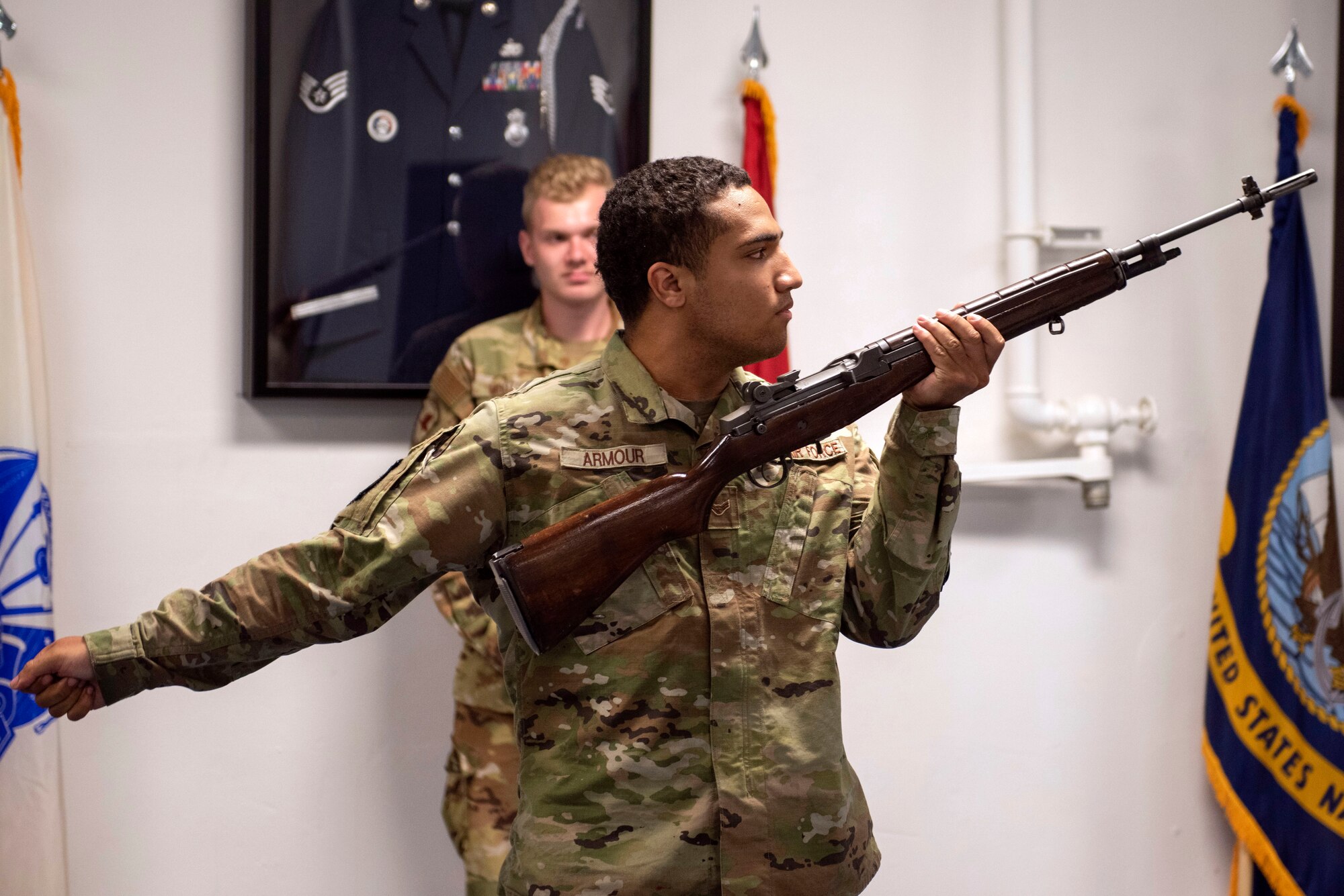 U.S. Air Force Airman 1st Class Devon Armour, a Joint Base Elmendorf-Richardson Honor Guardsman, demonstrates how to perform a rifle salute during an Honor Guard Open House at JBER, Alaska, July 19, 2021. The Honor Guard hosted the event to encourage Airmen to participate in the Honor Guard program. (U.S. Air Force photo by Senior Airman Emily Farnsworth)