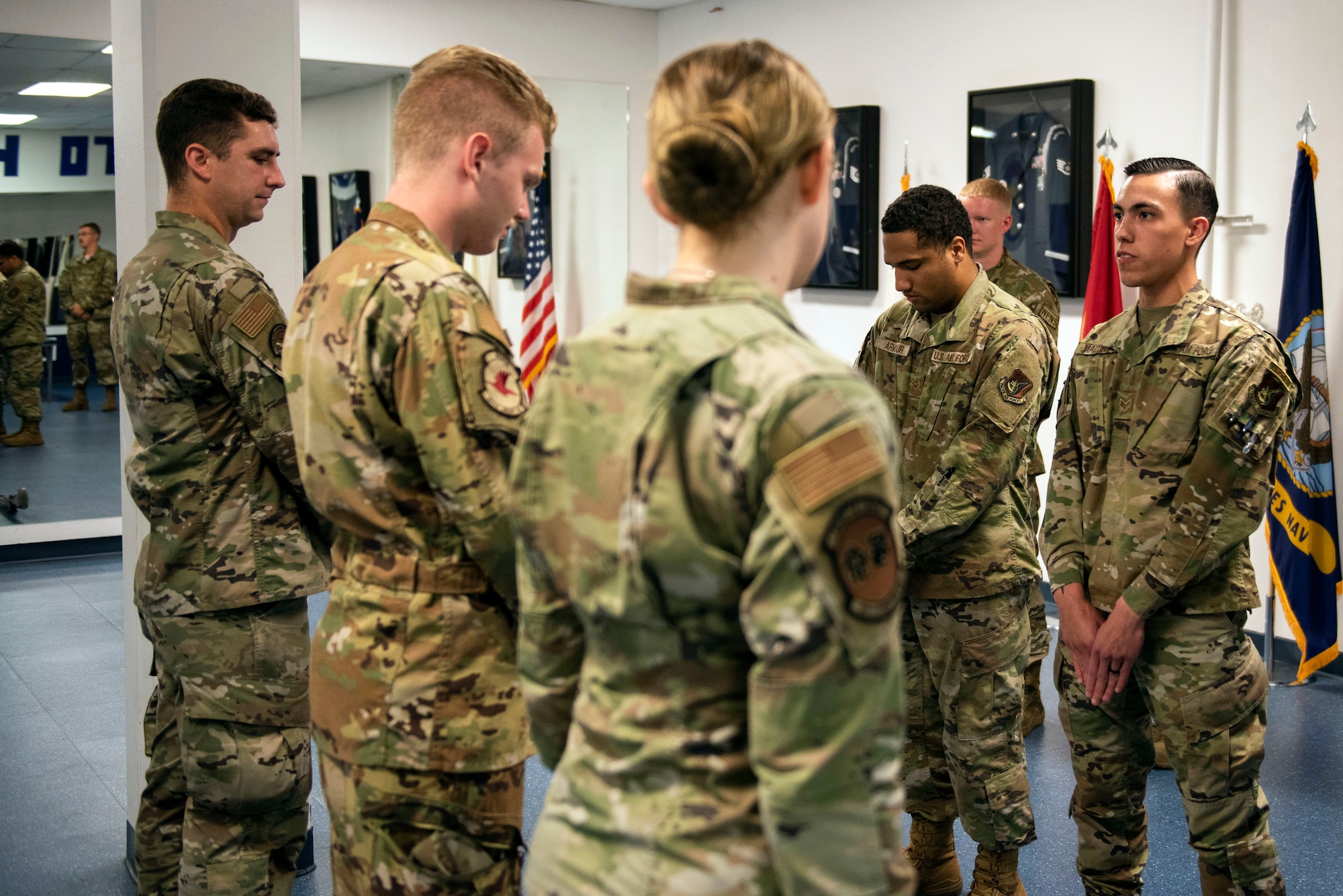 U.S. Air Force Airman 1st Class Devon Armour, left, and U.S. Air Force Senior Airman Armani Martinez, both Joint Base Elmendorf-Richardson Honor Guardsmen, demonstrate drill movements during an Honor Guard Open House at JBER, Alaska, July 19, 2021. The Honor Guard hosted the event to encourage Airmen to participate in the Honor Guard program. (U.S. Air Force photo by Senior Airman Emily Farnsworth)