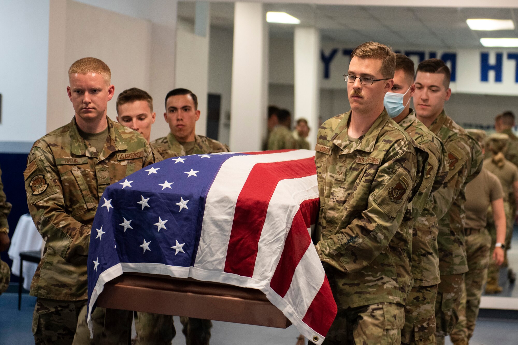 U.S. Airmen with the Joint Base Elmendorf-Richardson Honor Guard demonstrate how to carry a casket during an Honor Guard Open House at JBER, Alaska, July 19, 2021. The Honor Guard hosted the event to encourage Airmen to participate in the Honor Guard program. (U.S. Air Force photo by Senior Airman Emily Farnsworth)