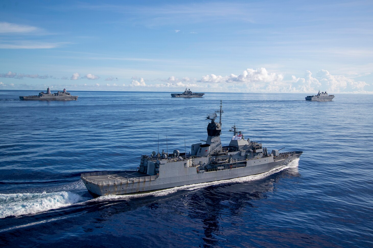 Amphibious assault ship USS America (LHA 6), steams alongside Royal Australian Navy (RAN) Canberra-class landing helicopter dock ship HMAS Canberra (L02), Antonio-class amphibious transport dock USS New Orleans (LPD 18), Japan Maritime Self Defense Force Takanami-class destroyer JS Makinami (DD 112) and RAN Anzac-class frigate HMAS Ballarat (FFH 155) conduct maritime maneuvers during the U.S.-led Large Scale Global Exercise 21. LSGE 21 is global command and control exercise, with a regional focus, to enhance integration of the U.S., allies and partners in the Indo-Pacific region.