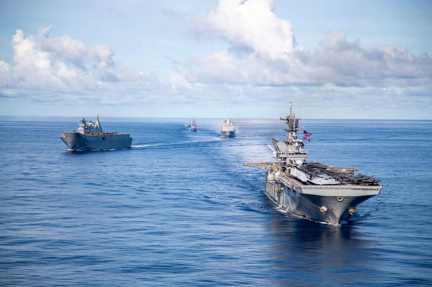Amphibious assault ship USS America (LHA 6), steams alongside Royal Australian Navy (RAN) Canberra-class landing helicopter dock ship HMAS Canberra (L02), Antonio-class amphibious transport dock USS New Orleans (LPD 18), Japan Maritime Self Defense Force Takanami-class destroyer JS Makinami (DD 112) and RAN Anzac-class frigate HMAS Ballarat (FFH 155) conduct maritime maneuvers during the U.S.-led Large Scale Global Exercise 21. LSGE 21 is global command and control exercise, with a regional focus, to enhance integration of the U.S., allies and partners in the Indo-Pacific region.