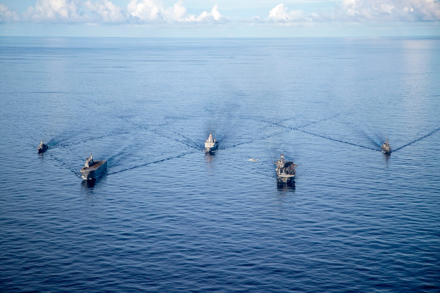Amphibious assault ship USS America (LHA 6), steams alongside Royal Australian Navy (RAN) Canberra-class landing helicopter dock ship HMAS Canberra (L02), Antonio-class amphibious transport dock USS New Orleans (LPD 18), Japan Maritime Self Defense Force Takanami-class destroyer JS Makinami (DD 112) and RAN Anzac-class frigate HMAS Ballarat (FFH 155) conduct maritime maneuvers during the U.S.-led Large Scale Global Exercise 21. LSGE 21 is global command and control exercise, with a regional focus, to enhance integration of the U.S., allies and partners in the Indo-Pacific region.