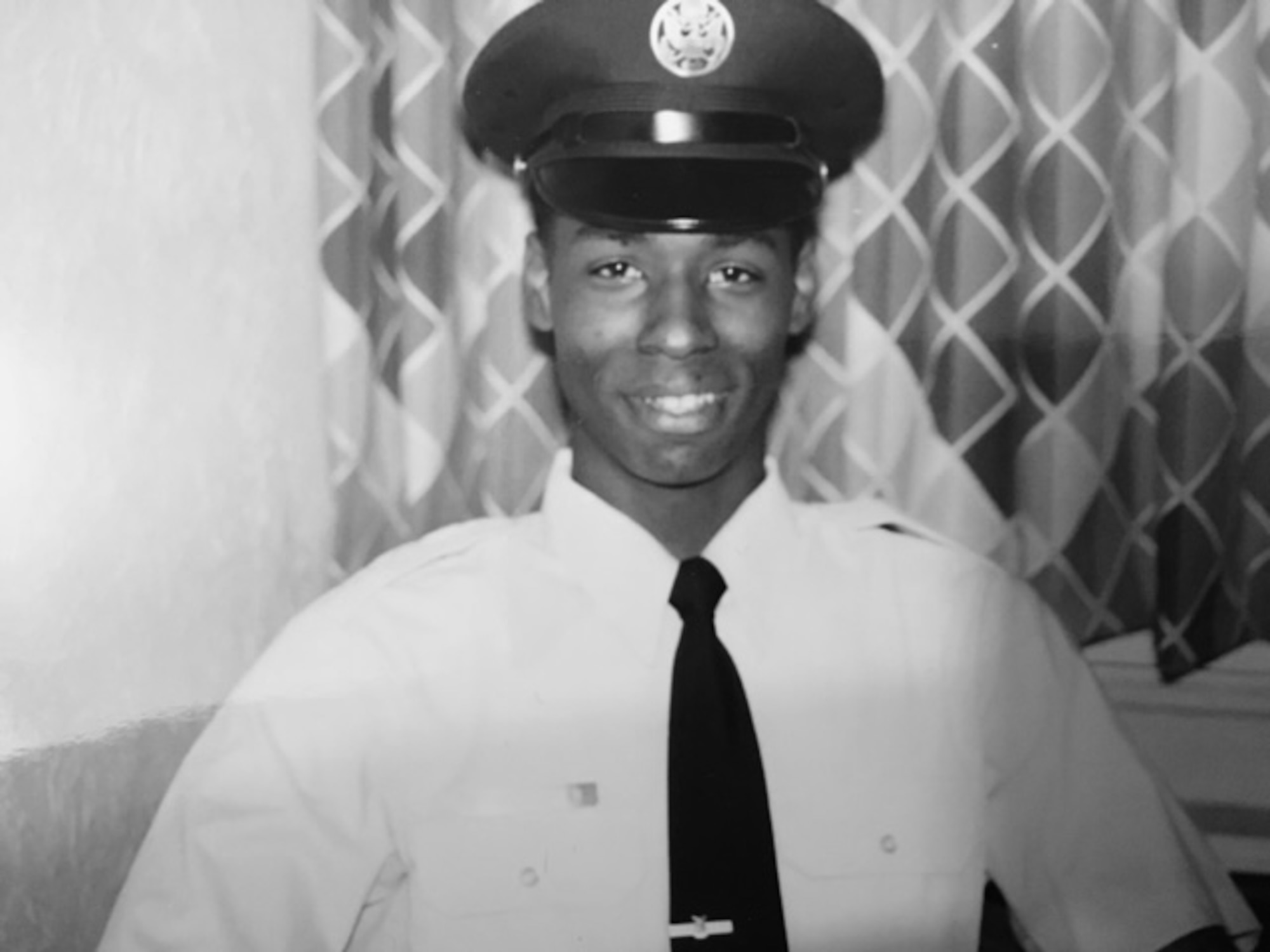 Then-Airman Kendall Briscoe smiles for a photo at basic military training in October 1989. Briscoe joined as an 18-year-old with a desire to move out of his mom’s house and travel the world for a quick enlistment, but ended up spending 32 years in the service before retiring as a chief master sergeant. (Courtesy photo)