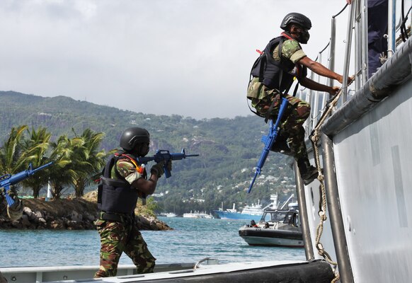 (Aug. 3, 2021) Members of the Seychellois Coast Guard board the Seychellois patrol boat SCGS La Fleche (P32) during visit, board, search, and seizure training as part of exercise Cutlass Express 2021 in Victoria, Seychelles, Aug. 3, 2021. Cutlass Express is designed to improve regional cooperation, maritime domain awareness and information sharing practices to increase capabilities between the U.S., East African and Western Indian Ocean nations to counter illicit maritime activity.