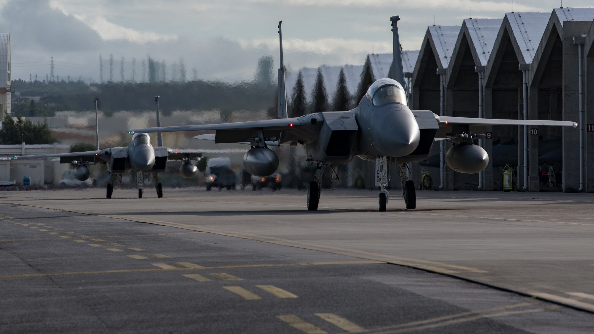 U.S. Air Force F-15C Eagles assigned the 44th Fighter Squadron taxi at Kadena Air Base, Japan, before departing in support of Red Flag-Alaska, July 29, 2021.