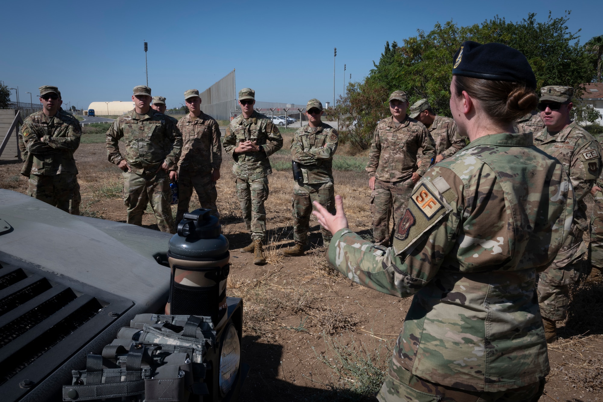 Airmen being briefed by instructor