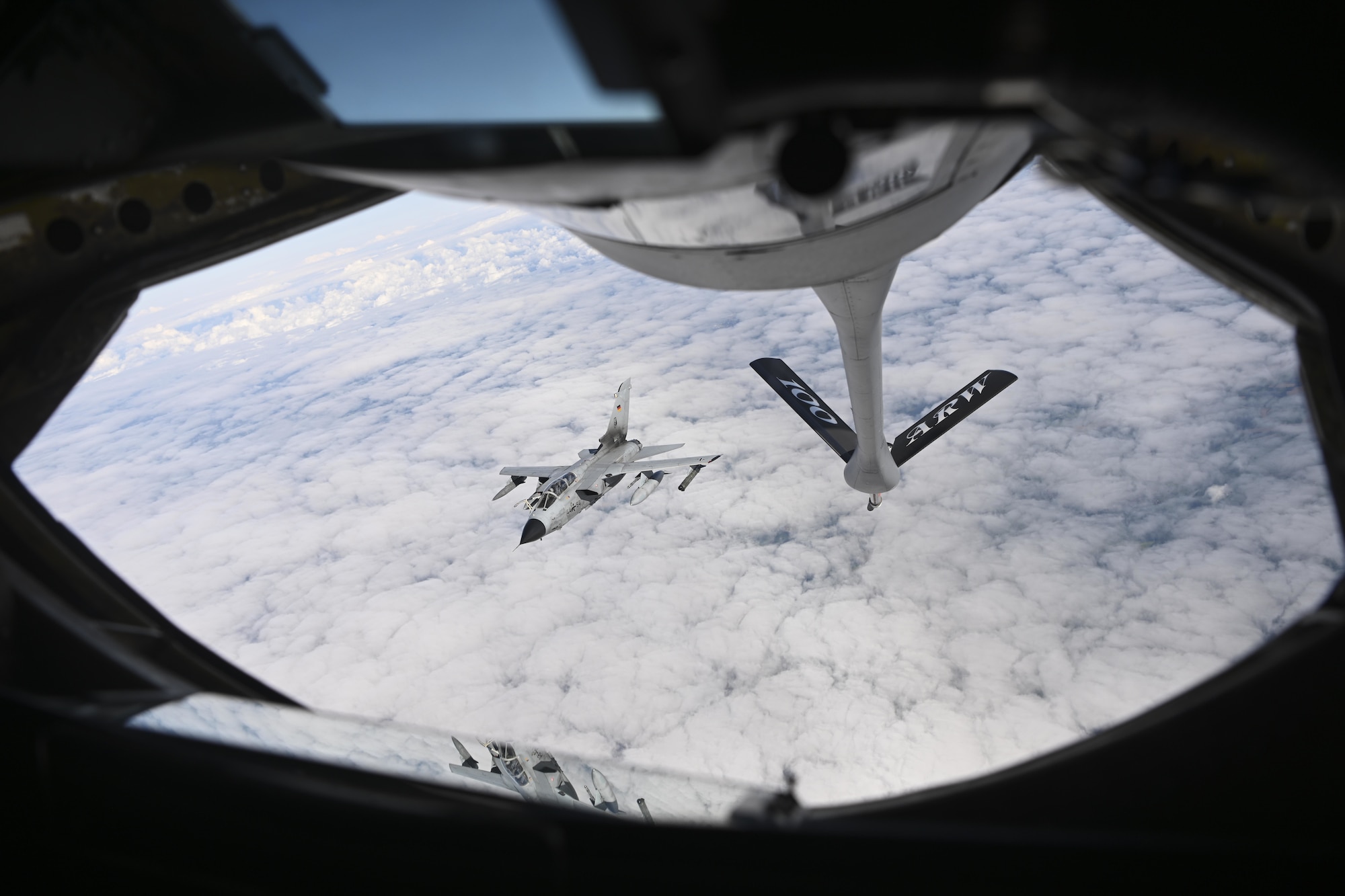 A German air force Tornado aircraft departs after receiving fuel from a U.S. Air Force KC-135 Stratotanker aircraft assigned to the 100th Air Refueling Wing, Royal Air Force Mildenhall, England, over Germany Aug. 2, 2021. Training with European allies enhances the collective security of the continent. (U.S. Air Force photo by Senior Airman Joseph Barron)