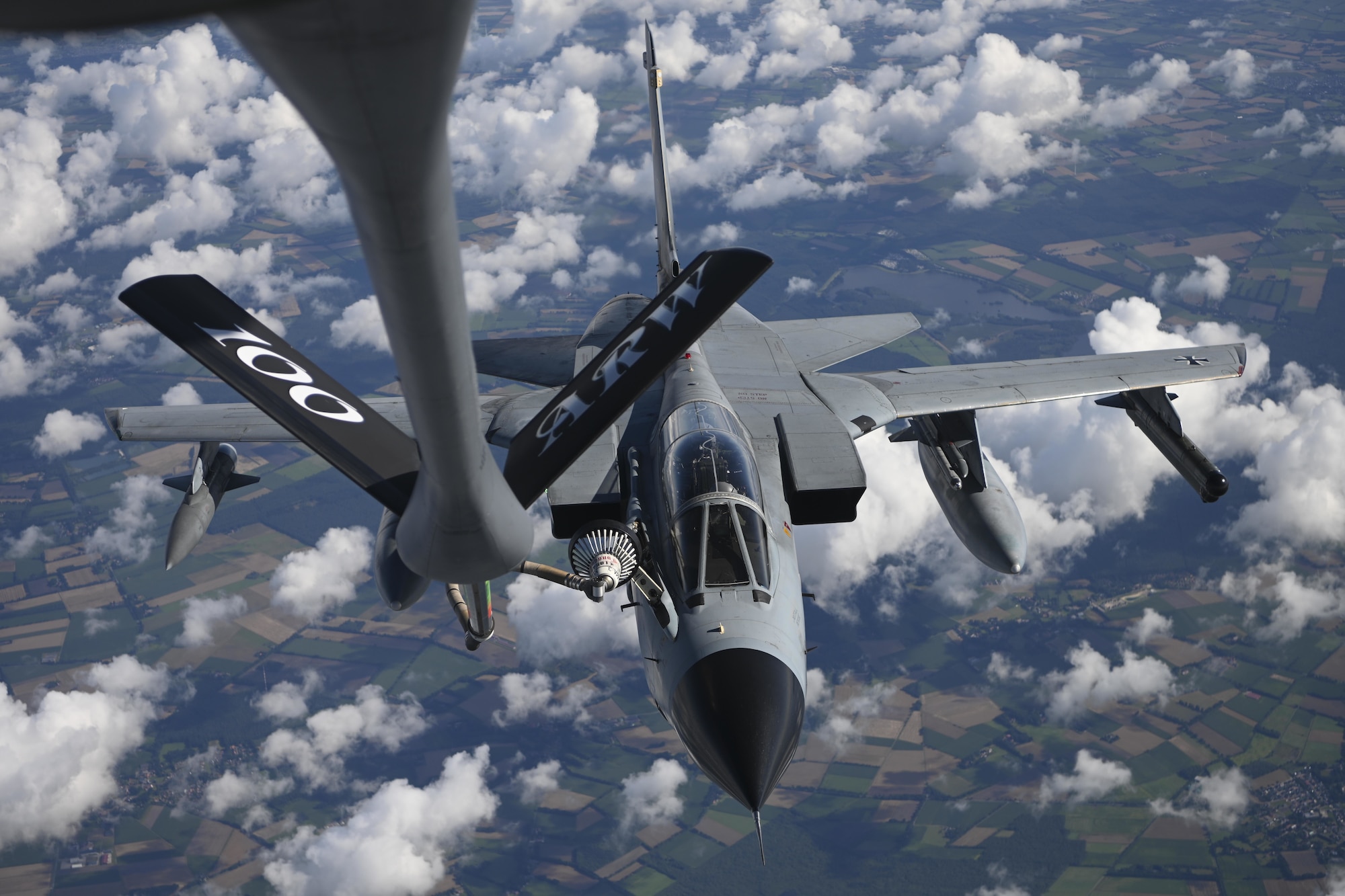 A German air force Tornado aircraft receives fuel from a U.S. Air Force KC-135 Stratotanker aircraft assigned to the 100th Air Refueling Wing, Royal Air Force Mildenhall, England, over Germany Aug. 2, 2021. Training with allies improves the readiness of U.S. forces to respond to aggression within Europe. (U.S. Air Force photo by Senior Airman Joseph Barron)