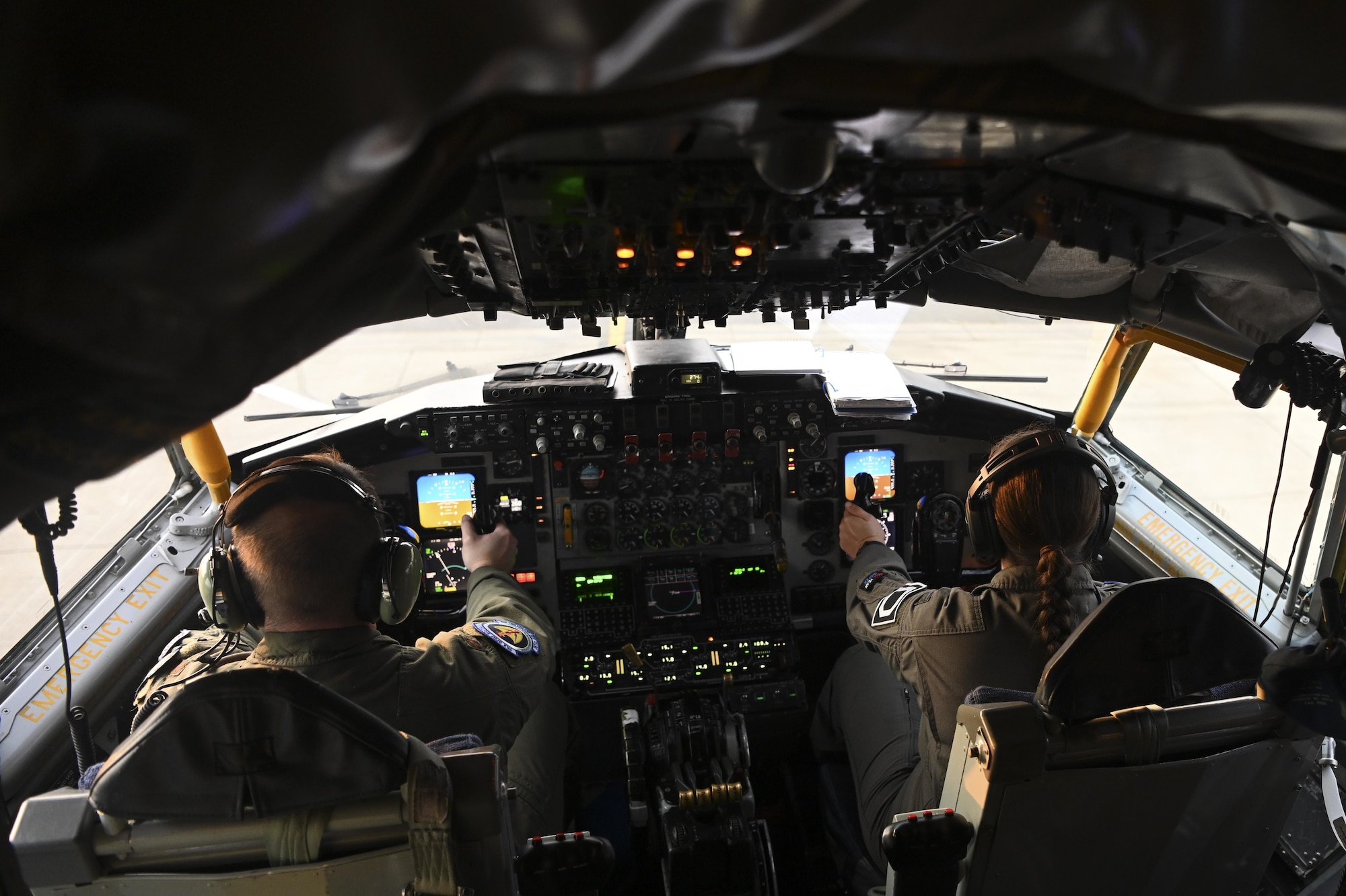 U.S. Air Force Maj. Grant Starkweather, 351st Air Refueling Squadron pilot, left, and Capt. Lindsey Summerlin, 351st ARS pilot, perform preflight checks on a KC-135 Stratotanker aircraft before a flight at Royal Air Force Mildenhall, England, Aug. 2, 2021. The aerial refueling capabilities of the 100th ARW’s KC-135s extend the range of U.S., allied and partner-nation fighter aircraft. (U.S. Air Force photo by Senior Airman Joseph Barron)