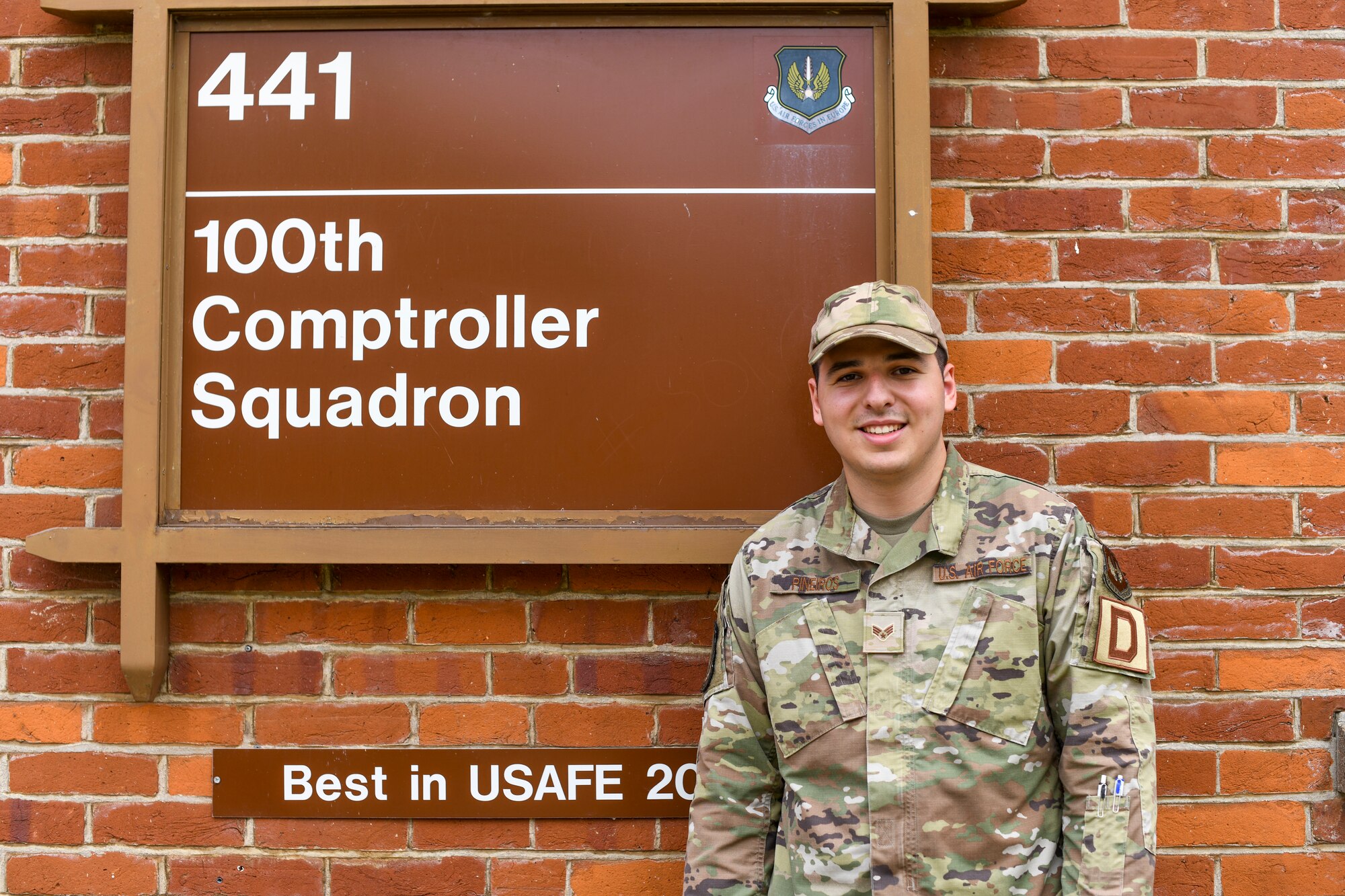 U.S. Air Force Senior Airman Jake Pineiros, 100th Comptroller Squadron finance technician poses outside of the finance building on Aug. 3, 2021 at Royal Air Force Mildenhall, England. Pineiros enjoys his job because he likes taking care of customer’s needs so that they can go on to complete the mission. (U.S. Air Force Photo by Senior Airman Antonia Herrera)
