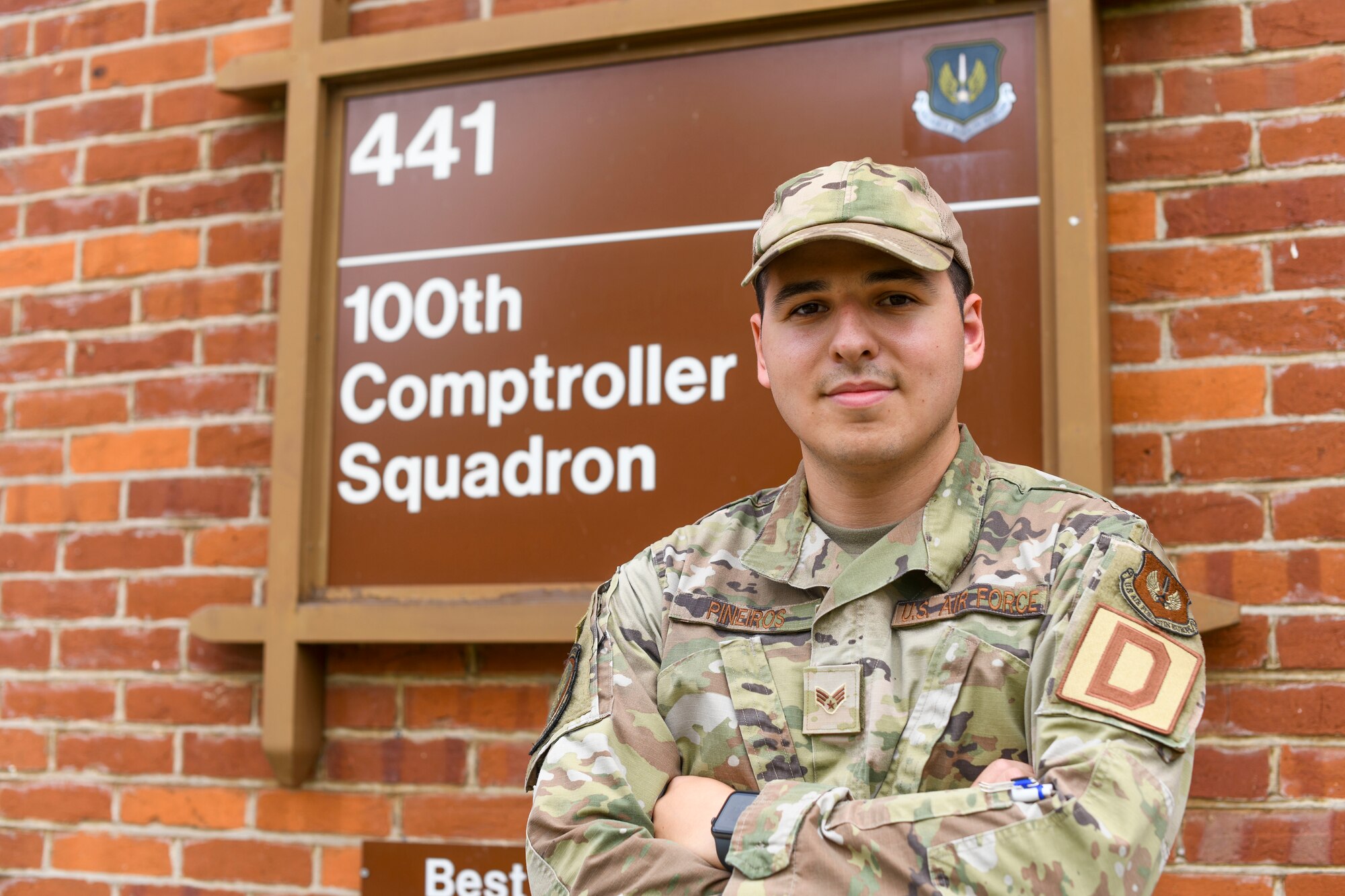 U.S. Senior Airman Jake Pineiros, 100th Comptroller Squadron finance technician poses in front of the finance building Aug. 3, 2021 at Royal Air Force Mildenhall, England. Pineiros was awarded Senior Airman Below the Zone in January 2021, an award given to Airmen who deserve to be promoted to the rank of E-4 six months ahead of time. (U.S. Air Force Photo by Senior Airman Antonia Herrera)