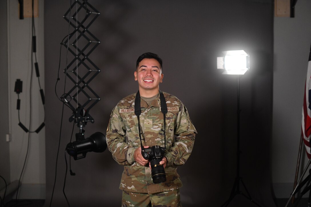 U.S. Air Force Airman Alvaro Villagomez, 100th Air Refueling Wing Public Affairs apprentice, poses in the studio July 28th, 2021, at Royal Air Force Mildenhall, England. Villagomez enjoys the communication part of his job and values the importance of his role as a storyteller for the U.S. Air Force. (U.S. Air Force photo by Senior Airman Antonia Herrera)