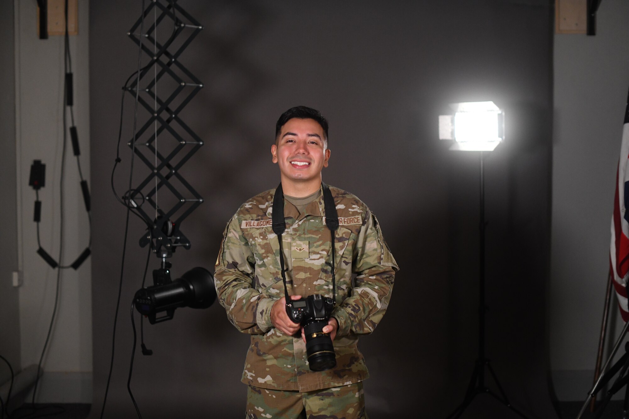 U.S. Air Force Airman Alvaro Villagomez, 100th Air Refueling Wing Public Affairs apprentice, poses in the studio July 28th, 2021, at Royal Air Force Mildenhall, England. Villagomez enjoys the communication part of his job and values the importance of his role as a storyteller for the U.S. Air Force. (U.S. Air Force photo by Senior Airman Antonia Herrera)