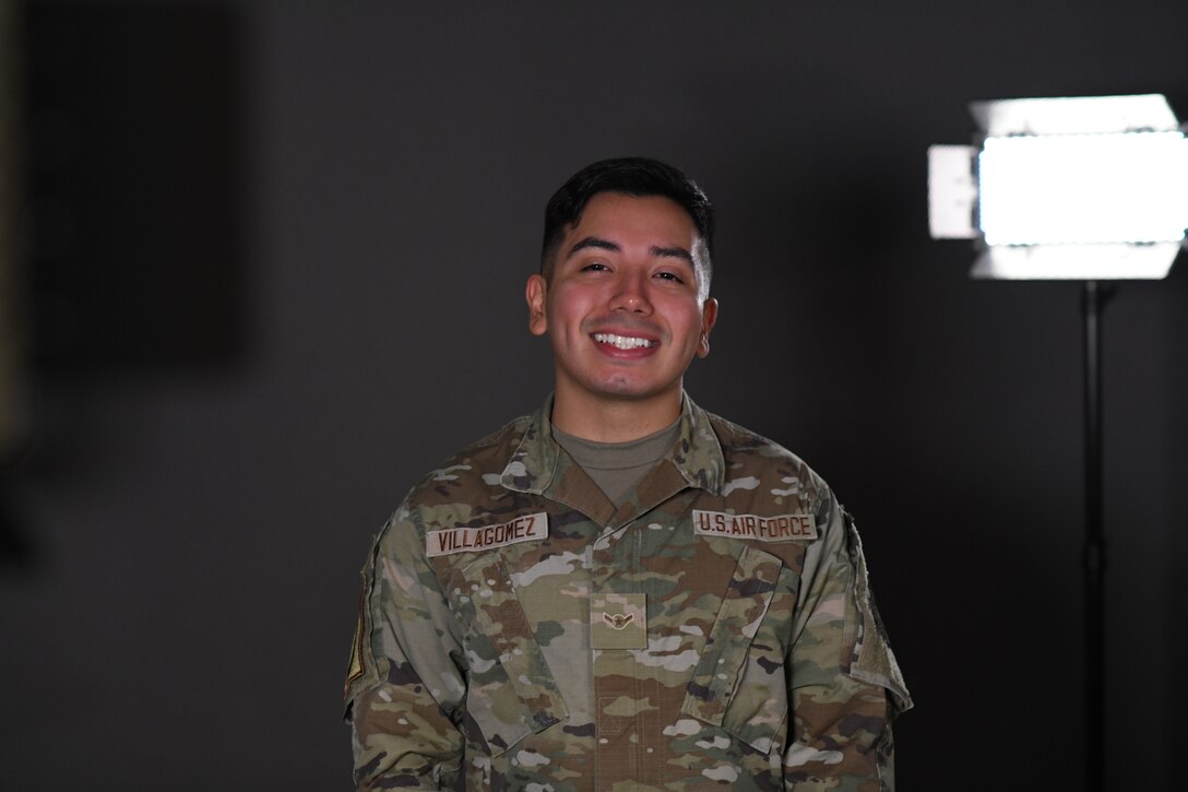 U.S. Air Force Airman Alvaro Villagomez, 100th Air Refueling Wing Public Affairs apprentice, poses in the studio July 28th, 2021, at Royal Air Force Mildenhall, England. Villagomez is a proud first-generation American and the first in his family to serve the U.S. military. (U.S. Air Force photo by Senior Airman Antonia Herrera)