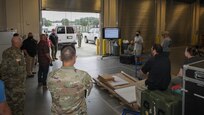 JOINT BASE LANGLEY-EUSTIS, Va. (Aug. 3, 2021) Joint Task Force Civil Support (JTF-CS) Incident Support Team 3 Logistics Officer Air Force Maj. Ryan Crean, middle right, gives a convoy brief to JTF-CS incident support team members prior to departing during exercise Vibrant Response 21.2.