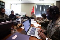 NASHVILLE, Tenn. (Aug. 5, 2021) Air Force Maj. Lyndel Miller listens to an operations and intelligence update as part of exercise Vibrant Response 21.2.