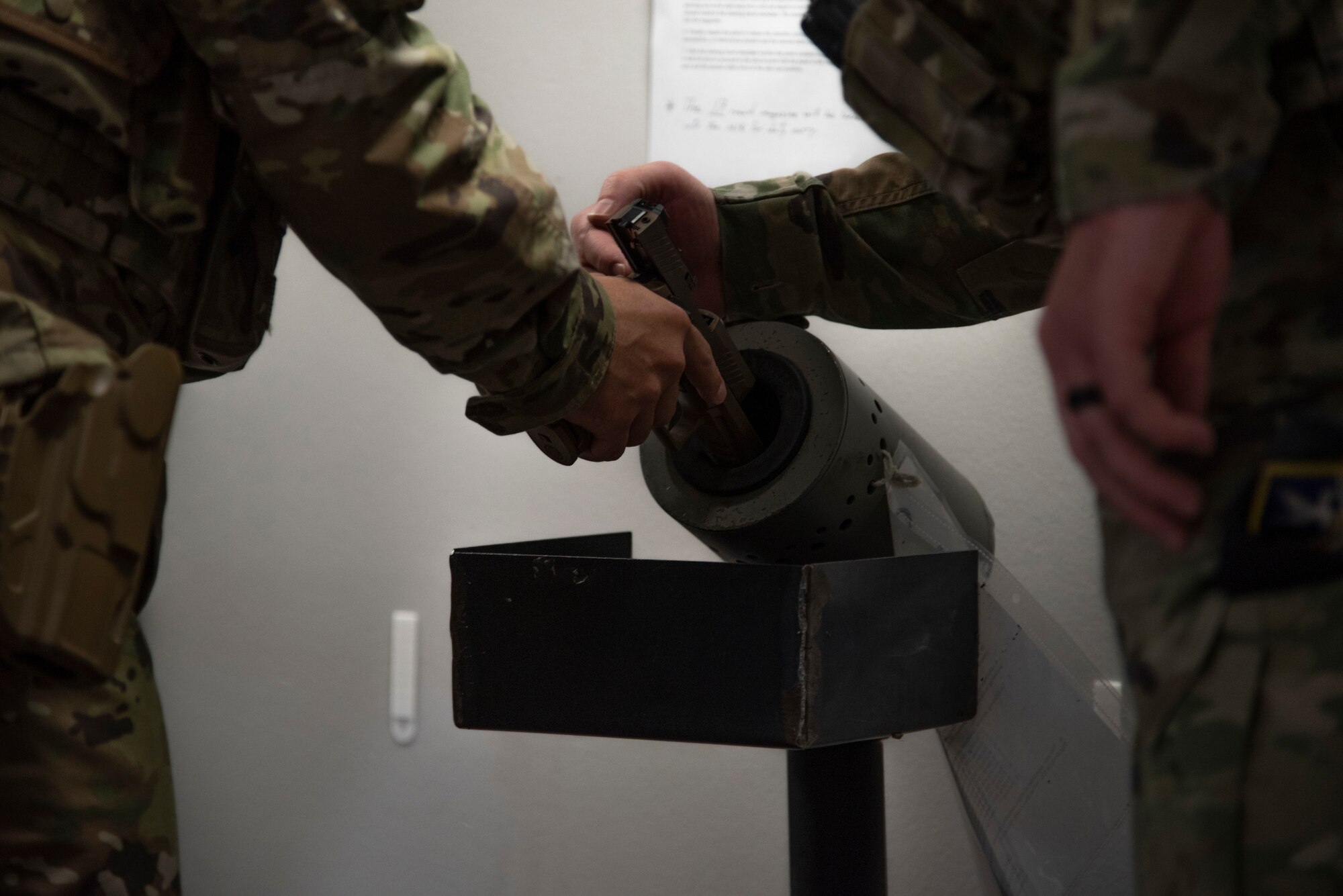 U.S. Air Force Col. David Wilson, 21st Mission Support Group commander, clears his issued M-18 pistol before leaving the 21st Security Forces Squadron headquarters for duty at Peterson Space Force Base, Colorado, July 22, 2021. (U.S. Space Force photo by Airman Aaron Edwards)