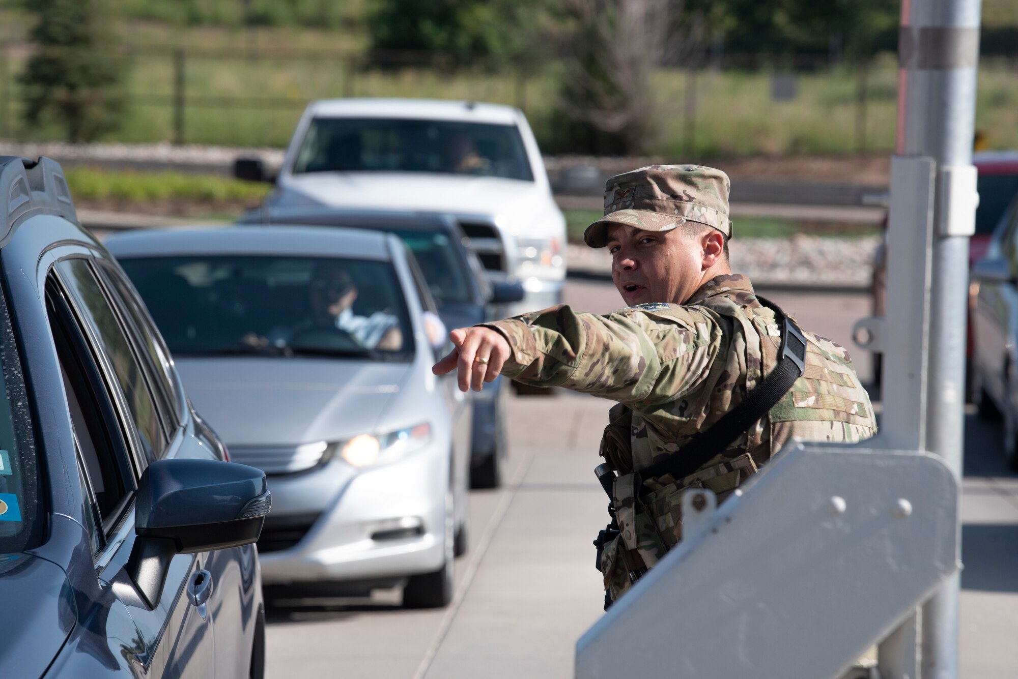 U.S. Air Force Col. David Wilson, 21st Mission Support Group commander, directs traffic outside the Peterson Space Force Base West Gate, Colorado, July 22, 2021. (U.S. Space Force photo by Airman Aaron Edwards)