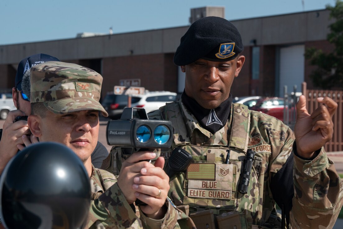 U.S. Air Force Col. David Wilson, 21st Mission Support Group commander, learns to properly use a radar gun to measure the speed of vehicles on the street at Peterson Space Force Base, Colorado, July 22, 2021. (U.S. Space Force photo by Airman Aaron Edwards)