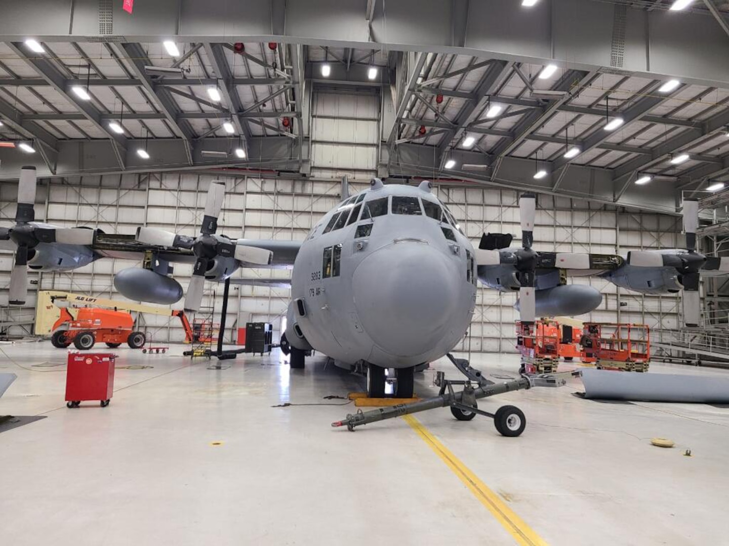 A U.S. Air Force C-130 Hercules from the 179th Airlift Wing, Ohio Air National Guard sits in a hangar at the 128th Air Refueling Wing, Wisconsin Air National Guard, in Milwaukee, Wisconsin, Feb. 18, 2021.