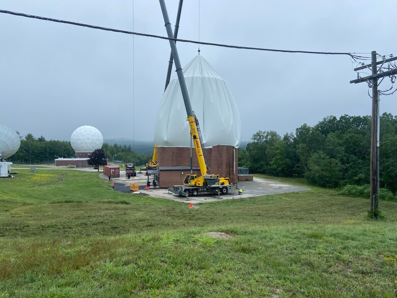 The 23rd Space Operations Squadron removes a radome to access the antenna underneath at New Boston Space Force Station, New Hampshire, July 19, 2021. The squadron removed the radome to replace the tracking system for their 13-meter antenna. (Courtesy photo)