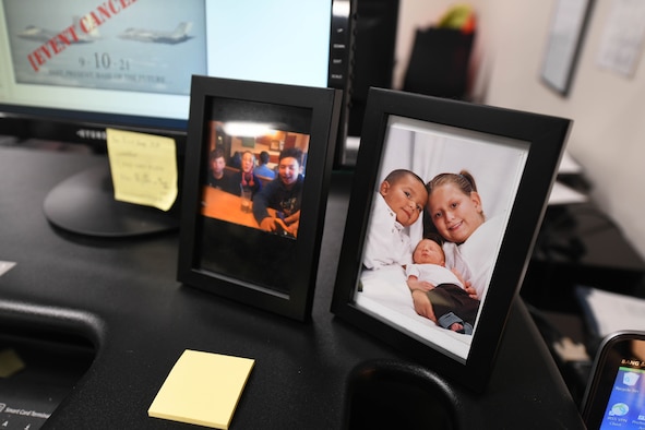 Family photos sit on the desk of U.S. Air Force Airman 1st Class Hailey Magana