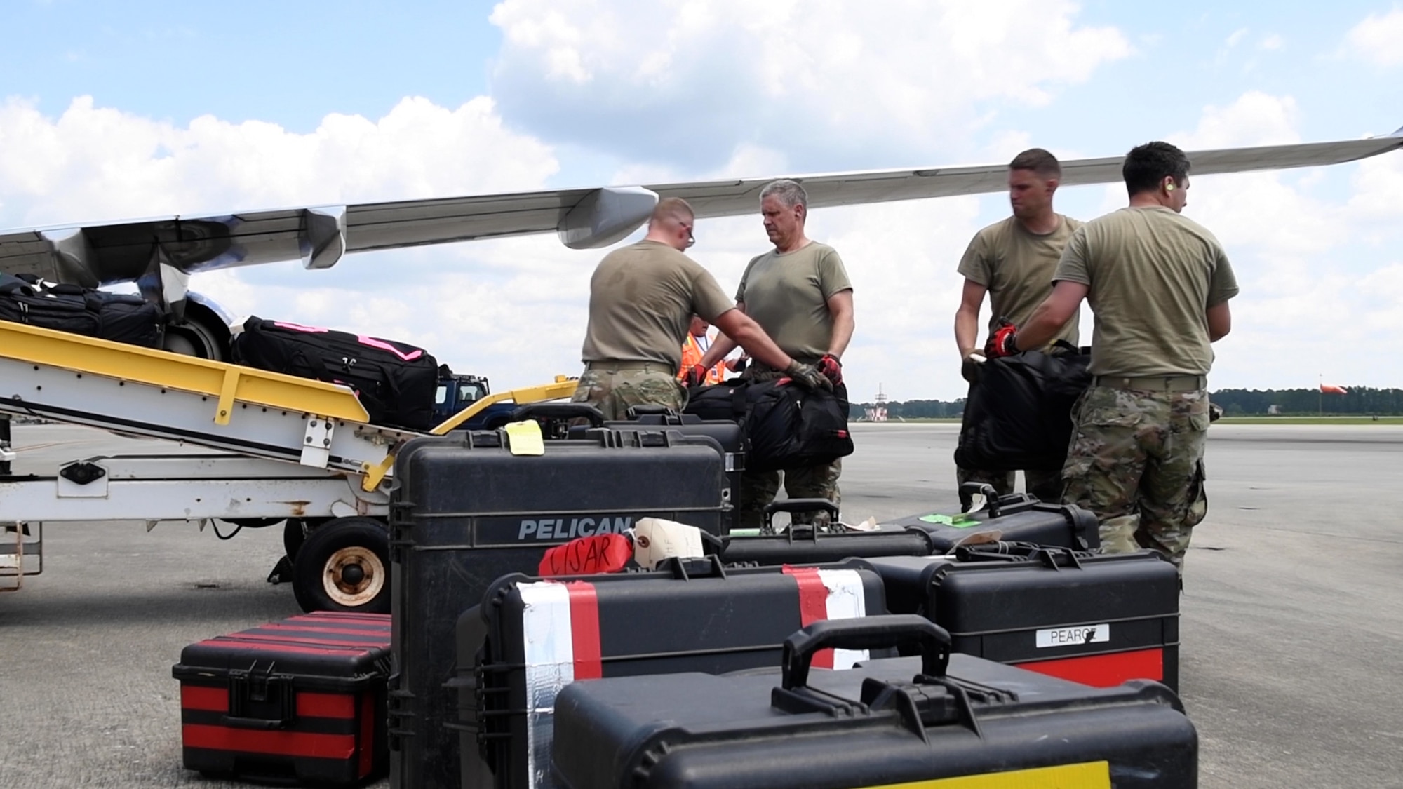 Reservists from the 419th Fighter Wing assist in loading 6,000 pounds of cargo on an airplane for personnel deploying from Hurlburt Field, Florida, July 23, 2021. The reservists were embedded with the 1st Special Operations Group for their two-week annual tour, working alongside active duty.