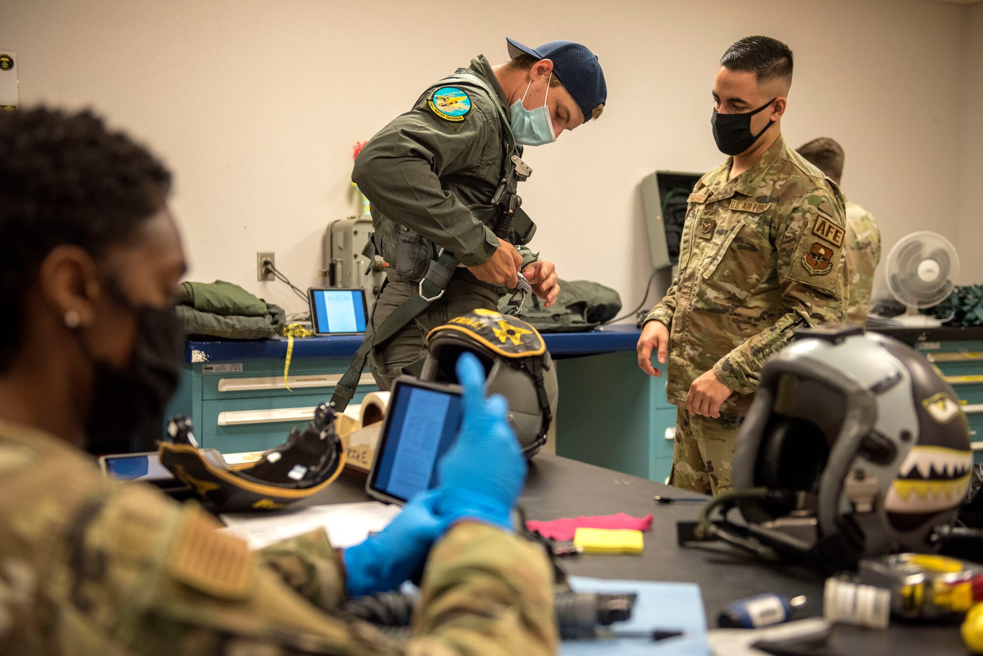 Scott Mayfield, NHL New York Islanders hockey player, gets fitted for flight equipment, Aug. 3, 2021, on Holloman Air Force Base, New Mexico. Mayfield toured the Optimizing the Human Weapon System facility, received aircrew flight equipment egress and parachute training, visited maintainers on the flight line and flew in an F-16 Viper, to understand the correlation of teamwork and training between the NHL and the U.S. Air Force. (U.S. Air Force photo by Staff Sgt. Christine Groening)