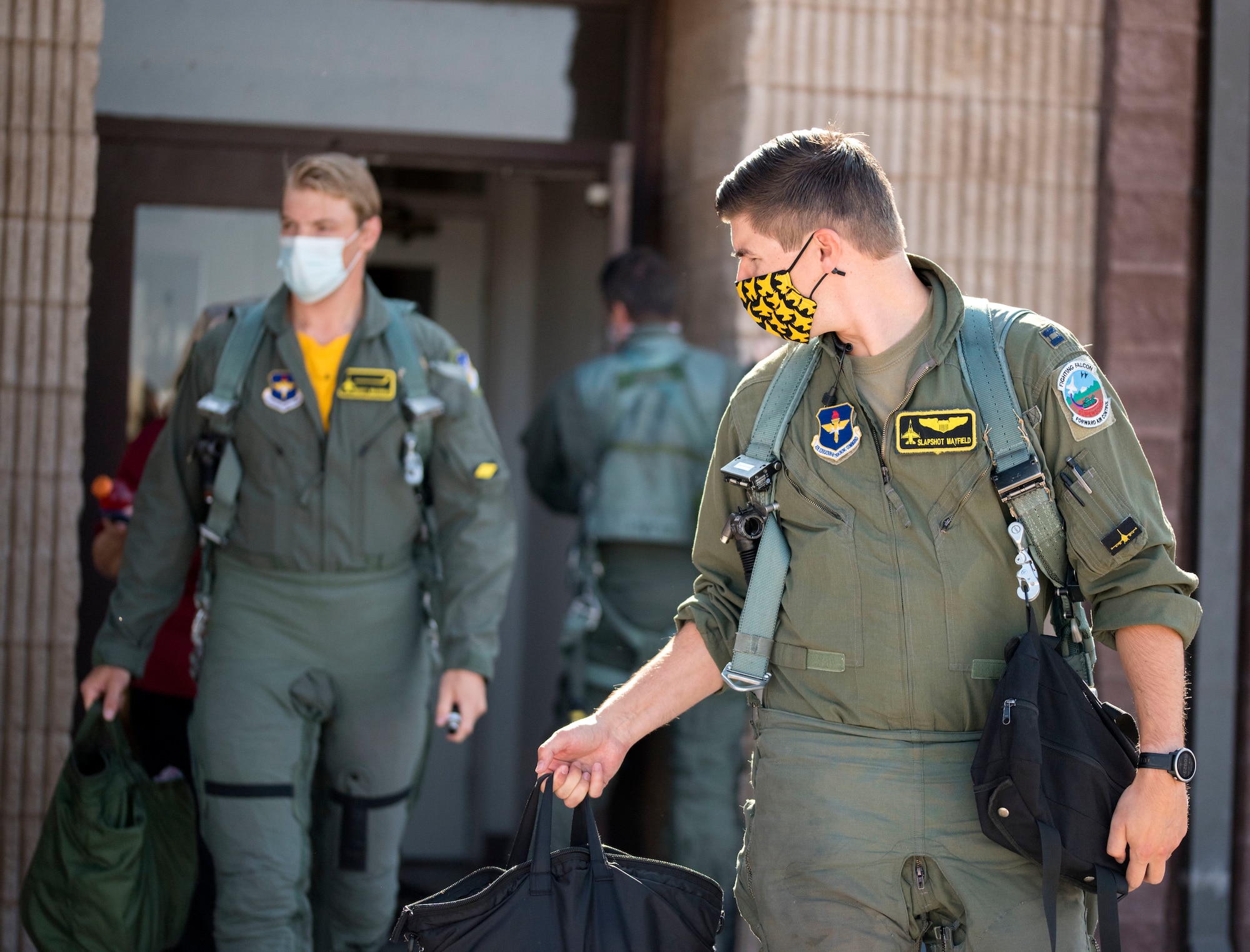 Capt. Patrick Mayfield, right, 314th Fighter Squadron instructor pilot, and Scott Mayfield, NHL New York Islanders hockey player, walk to the F-16 Viper prior to a familiarization flight, Aug. 4, 2021, on Holloman Air Force Base, New Mexico. One of Holloman’s newest assets that Scott visited was the Optimizing and Human Weapons System facility where he learned how to prepare for the stresses a U.S. Air Force fighter pilot endures in flight. (U.S. Air Force photo by Staff Sgt. Christine Groening)