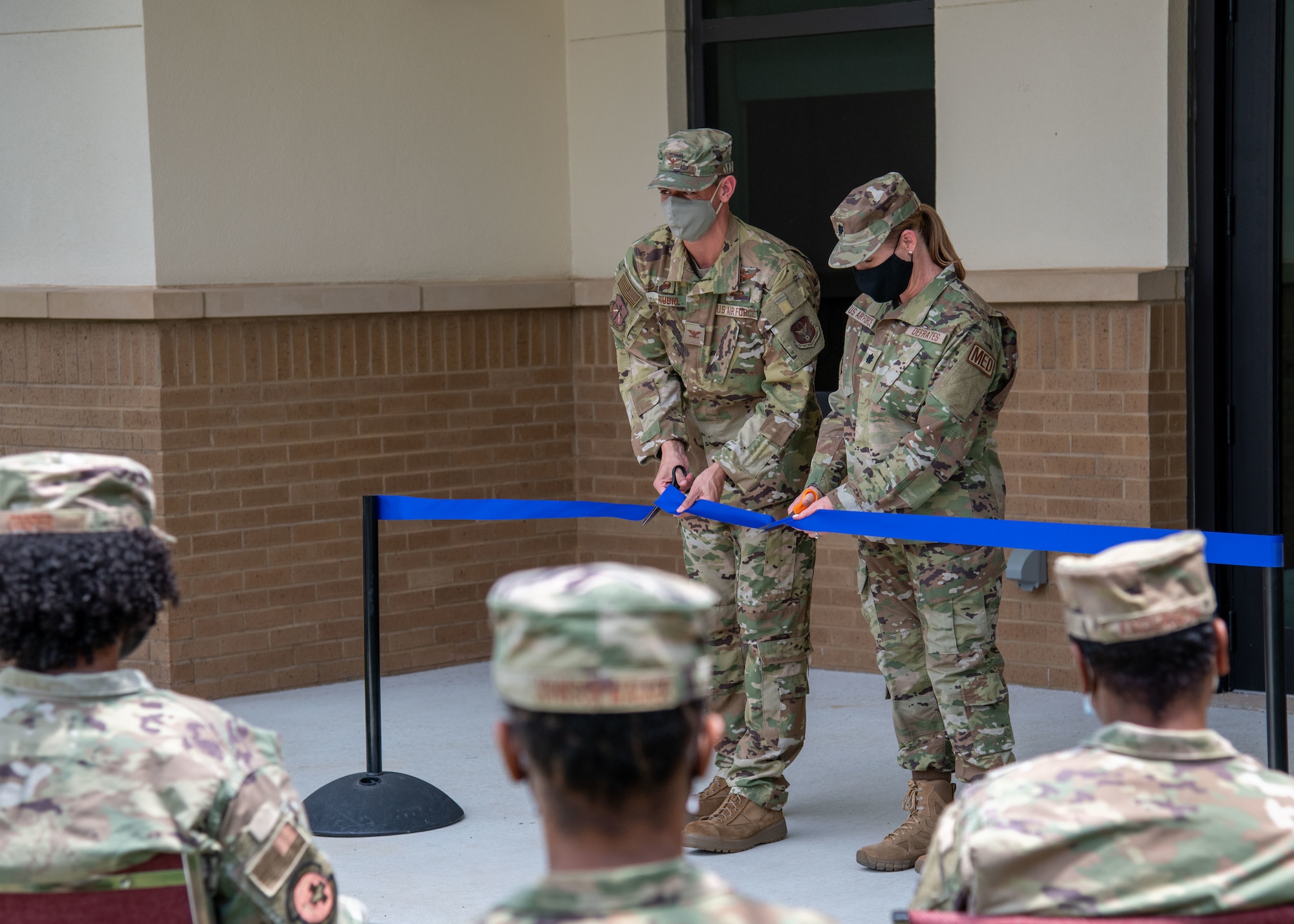 Col. Stuart M. Rubio, 403rd Wing commander, and Lt. Col. Lauren DeFrates, 403rd Aeromedical Staging Squadron deputy commander, cut the ceremonial ribbon marking the opening of the new ASTS building at Keesler Air Force Base, Miss., Aug. 6, 2021. The mission of the ASTS in-garrison is to ensure medical readiness for all 403rd Wing personnel. (U.S. Air Force by Staff Sgt. Kristen Pittman)