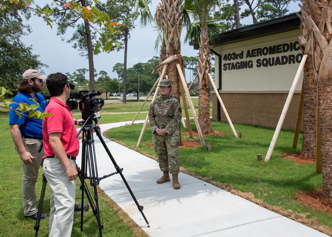 Chief Master Sgt. Jessica McBride, 403rd Aeromedical Staging Squadron superintendent, speaks to local media after a ribbon-cutting ceremony for her unit’s new building at Keesler Air Force Base, Miss., Aug. 6, 2021. The new facilities will allow the squadron to work in a more cohesive environment and allows capabilities they previously had to rely on the Active Duty facilities for. (U.S. Air Force by Staff Sgt. Kristen Pittman)
