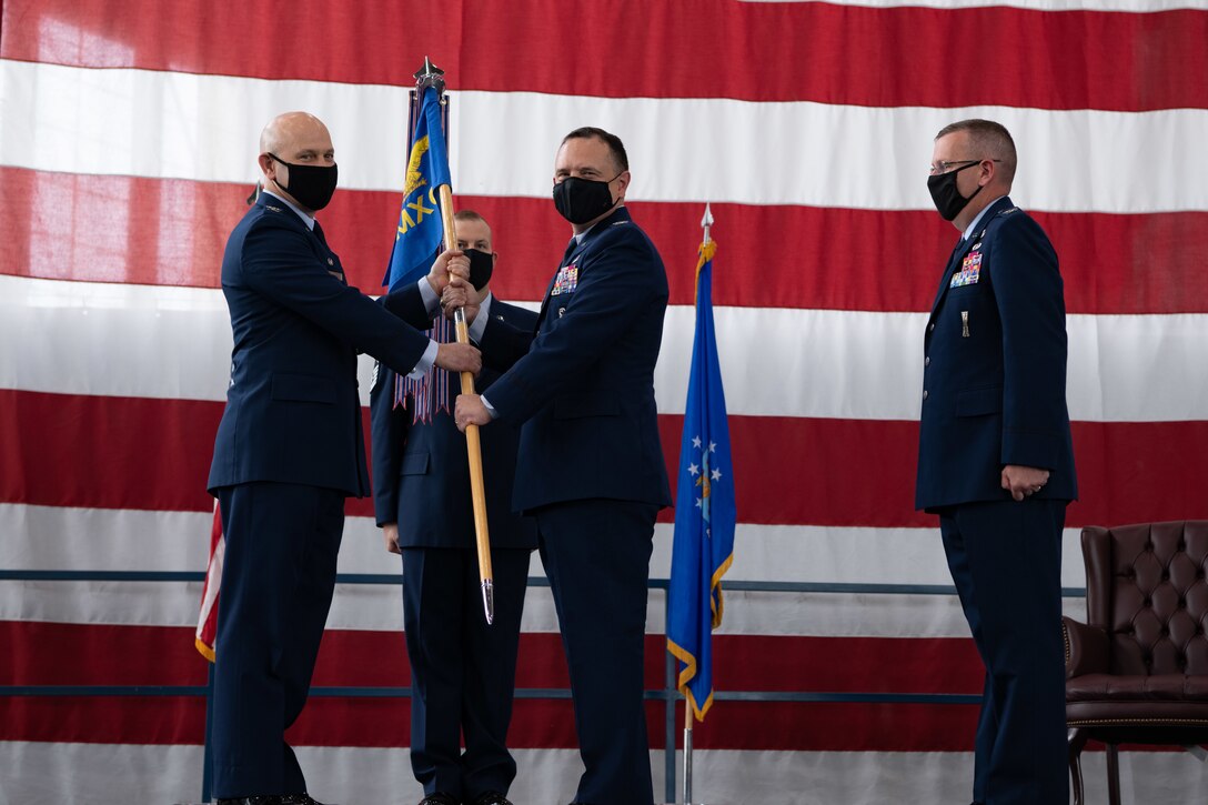 Col. Nathan Mitchell, the incoming 28th Maintenance Group commander, receives the 28th Maintenance Squadron’s guidon at Ellsworth Air Force Base, S.D., August 4, 2021.