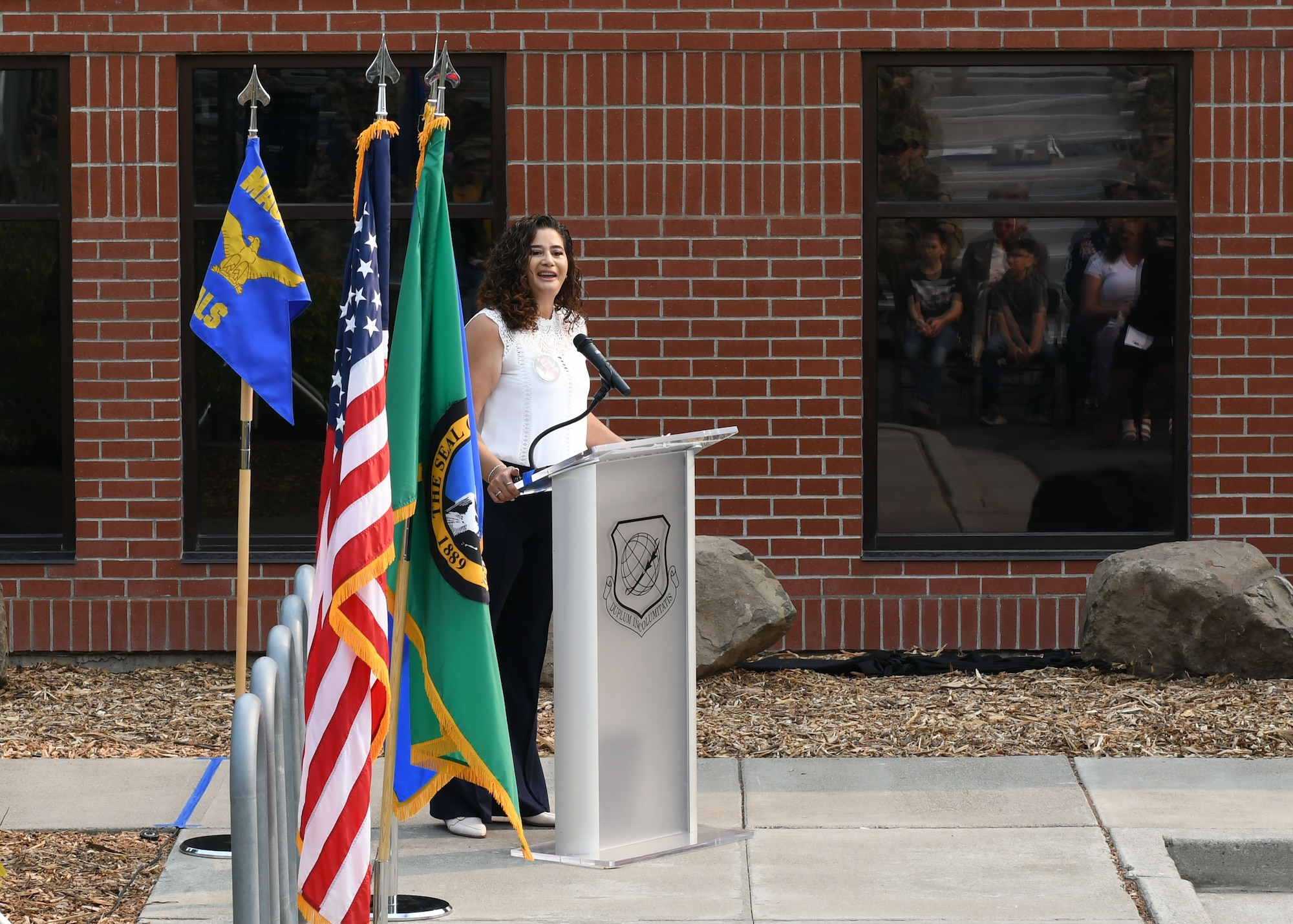 Family member of TSgt Mackey gives a speech.