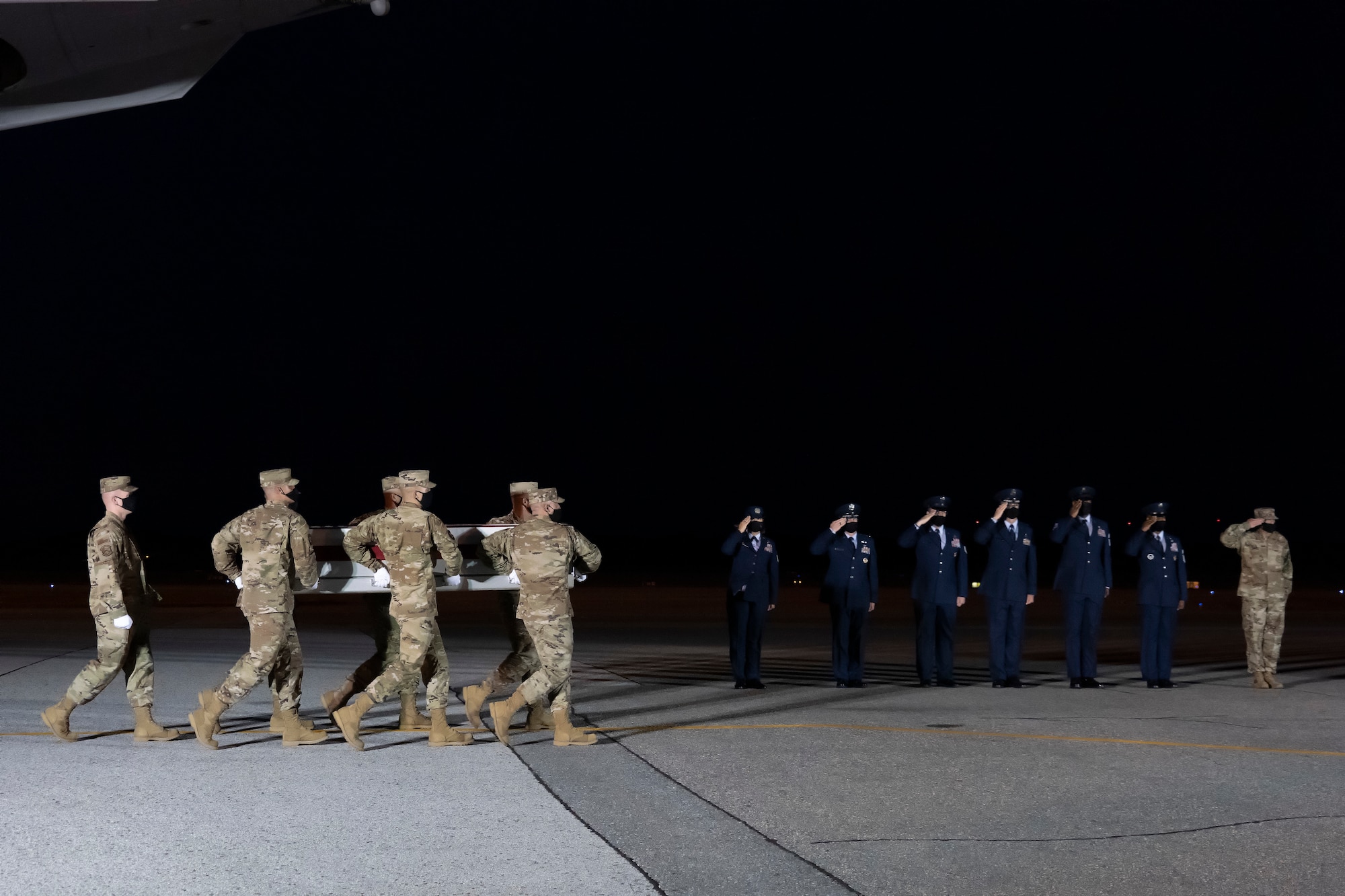 A U.S. Air Force carry team transfers the remains of Air Force Chief Master Sgt. Tresse Z. King of Raeford, North Carolina, August 6, 2021 at Dover Air Force Base, Delaware. King was assigned to the 96th Force Support Squadron, Eglin Air Force Base, Florida. (U.S. Air Force photo by Jason Minto)