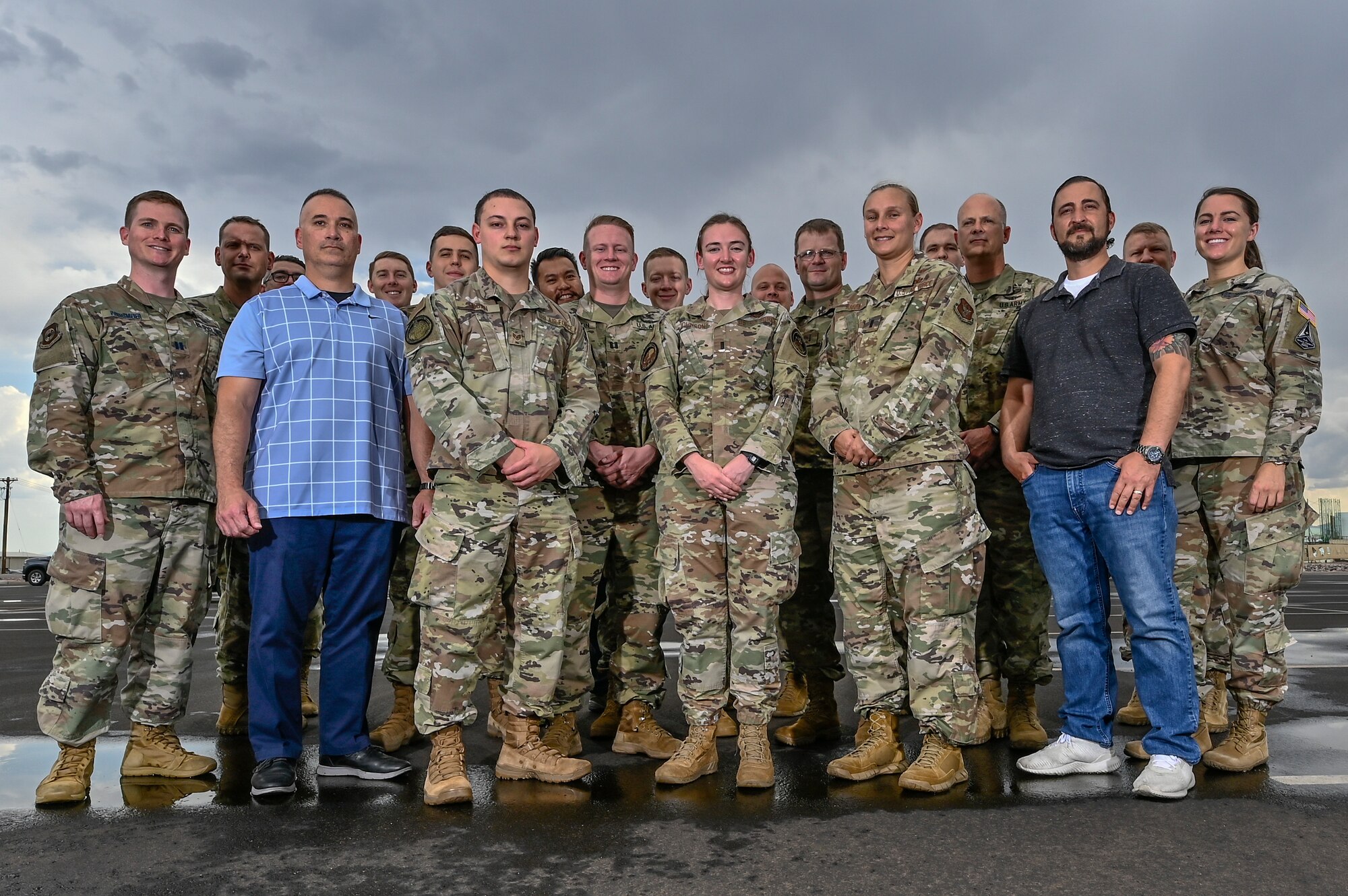 A group photo of civilian and military members