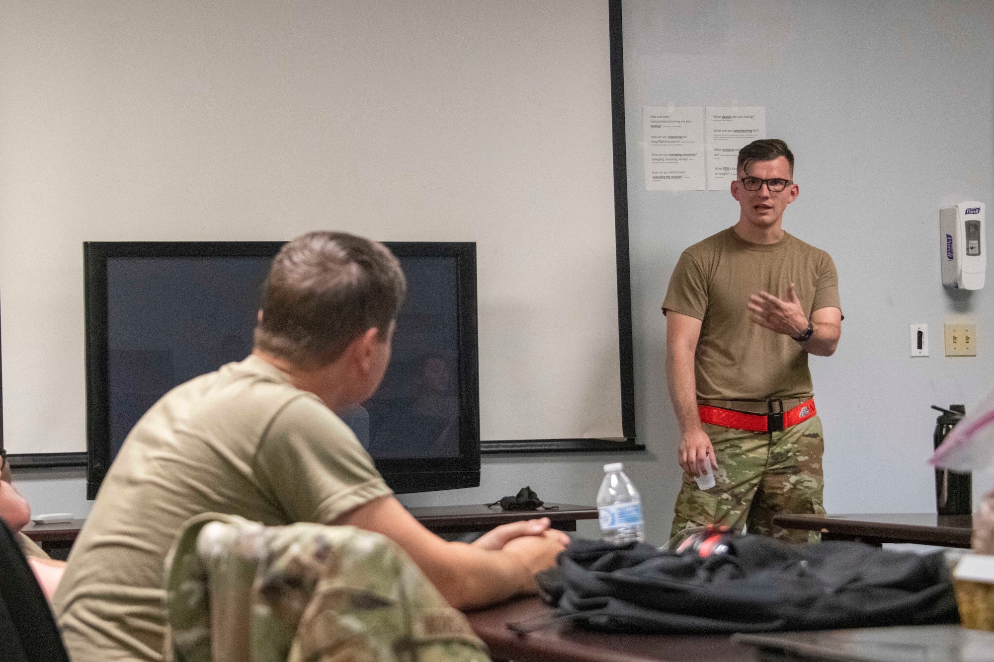 U.S. Air Force Staff Sgt. Spencer Lanston, 97th Logistics Readiness Squadron air freight supervisor, gives an over brief of the training day at Altus Air Force Base, Oklahoma, July 27, 2021.