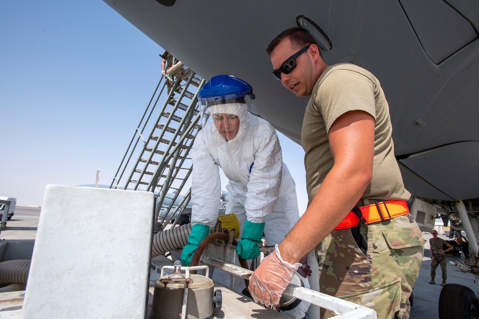 Female service members receives guidance during lavatory training