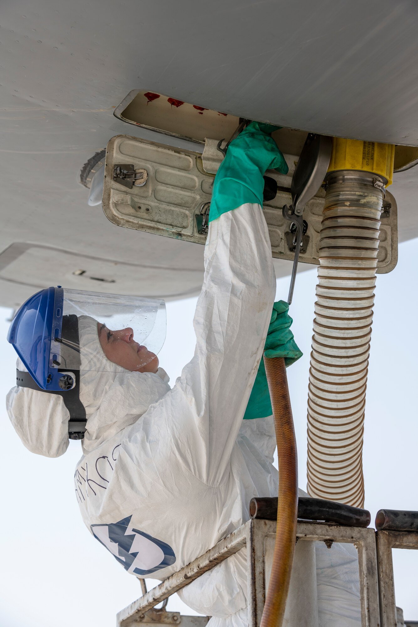 female under aircraft has hands in the lavatory compartment