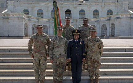 Yogananda D. Pittman, acting police chief, U.S. Capitol Police Department, poses in front of the U.S. Capitol Building with District of Columbia Army National Guard Joint Operations Center staff on the final day of National Guard operations in support of Capitol P.D., May 23, 2021. At the request of federal law enforcement agencies, the National Guard provided security, communications, medical evacuation, logistics and safety support to state, district and federal agencies. (U.S. Army National Guard photo by Staff Sgt. Andrew Enriquez)
