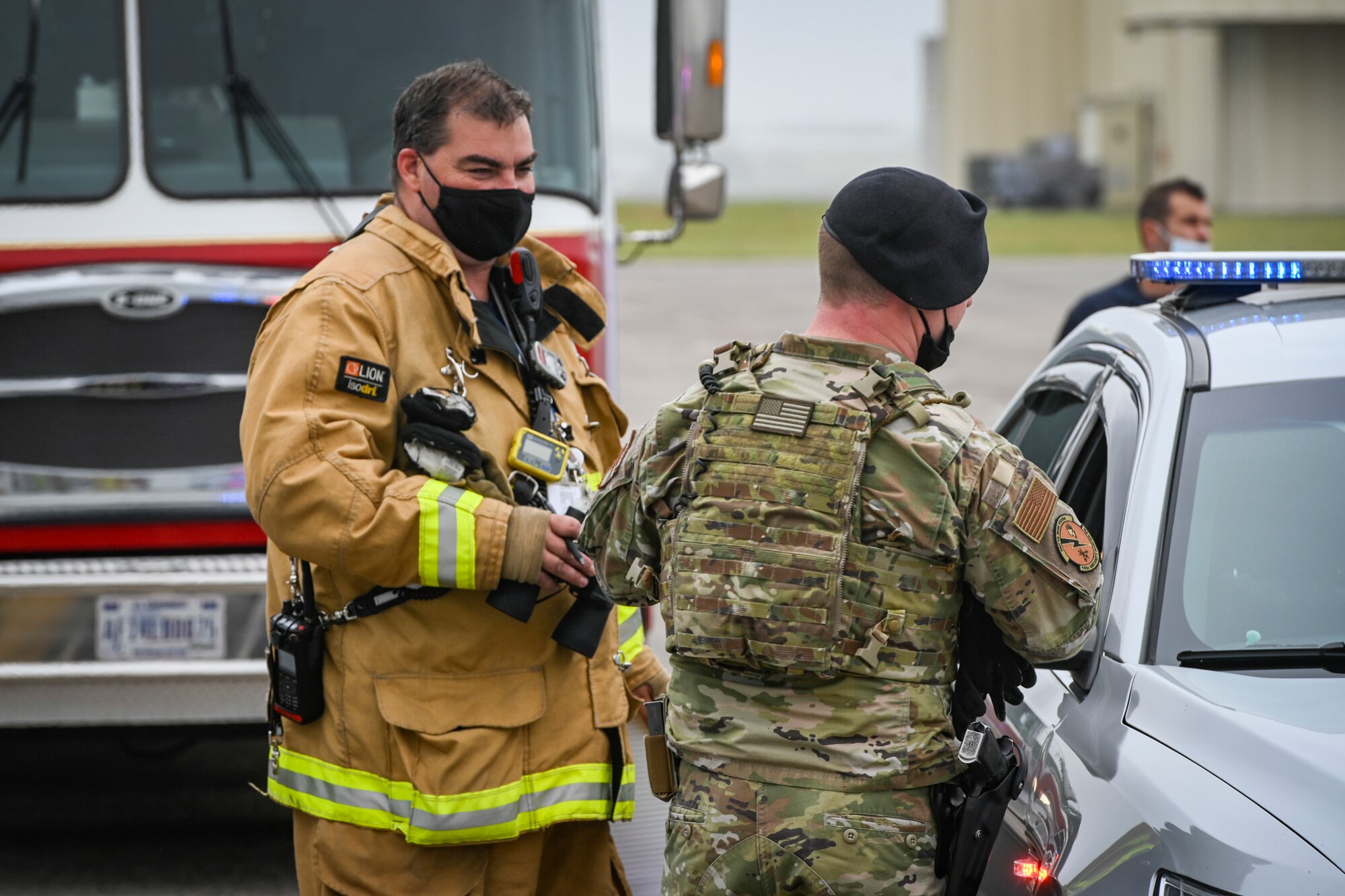 Brian Ellis (left) Connecticut Air National Guard Fire Department captain, and U.S. Air Force Staff Sgt. Gerard St. George, 103rd Security Forces Squadron, respond to a small unmanned aircraft system flying over Bradley Air National Guard Base during a drone response exercise conducted at the installation in East Granby, Connecticut, Aug. 5, 2021.  With the increased prevalence of drone activity around the world, the 103rd Security Forces Squadron partnered with the Transportation Security Administration and Connecticut State Police to conduct a multi-agency antiterrorism exercise that tested the base’s response to a drone incursion. (U.S. Air National Guard photo by Tech. Sgt. Steven Tucker)