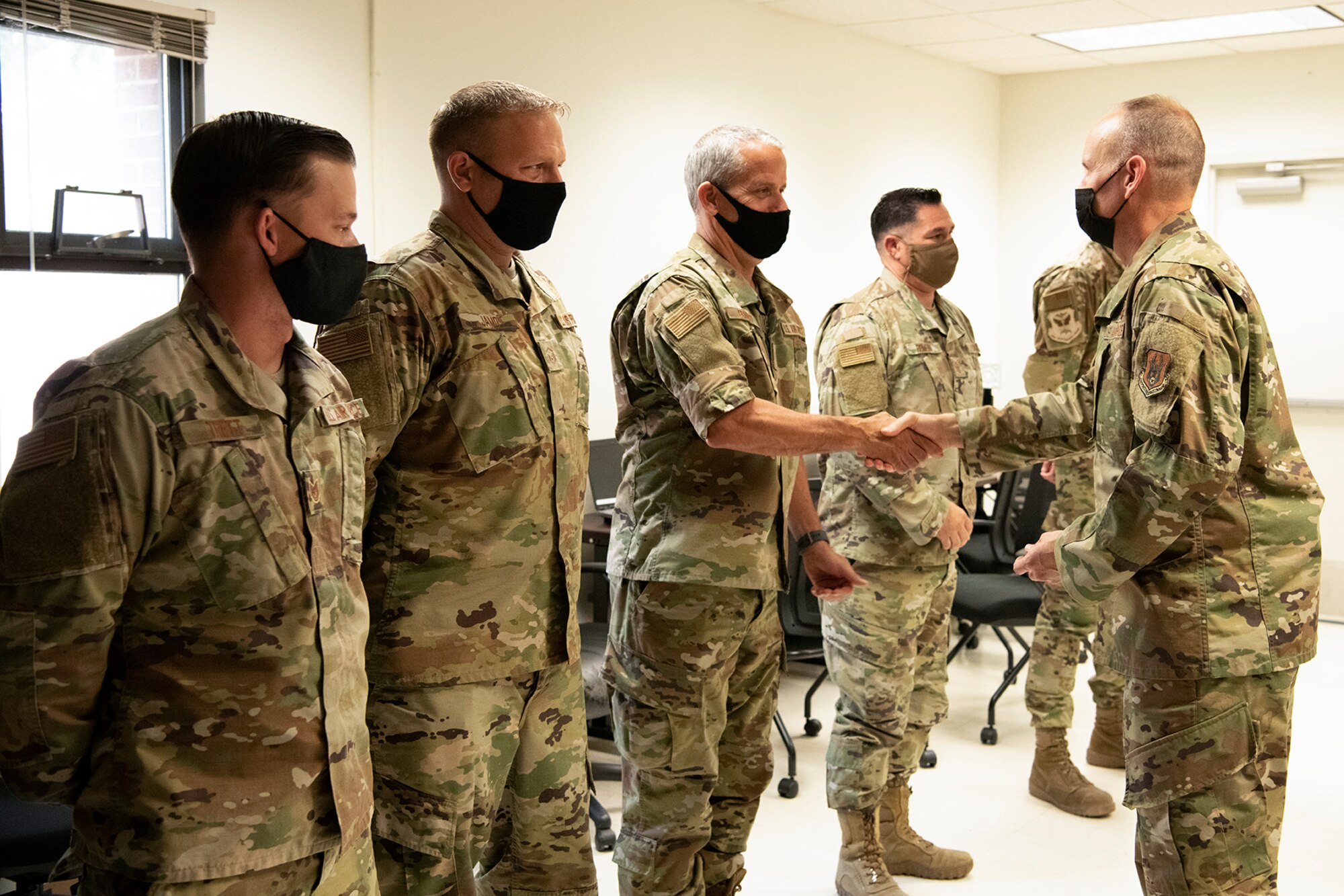 Col. Christopher Zidek, 302nd Airlift Wing commander, and Chief Master Sgt. Kahn Scalise, 302 AW command chief, congratulates reservists with the 302nd Maintenance Group Quality Assurance for winning the 2020 Air Force Reserve Command Logistics Readiness and Maintenance Award