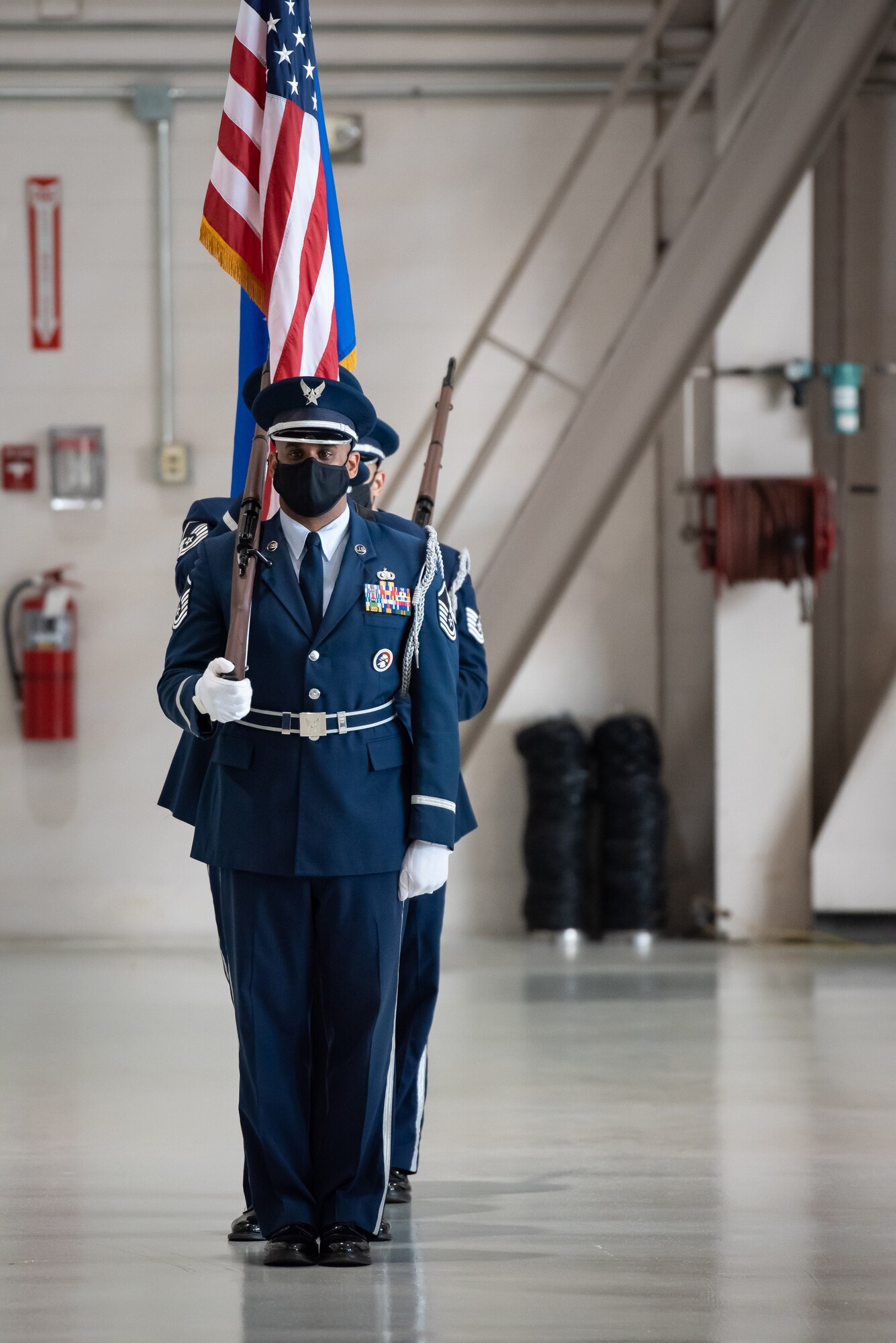 The 123rd Airlift Wing Honor Guard presents the colors during a ceremony to install a new commander of the 123rd Airlift Wing at the Kentucky Air National Guard Base in Louisville, Ky., Aug. 7, 2021. Col. Bruce Bancroft assumed the role from Col. David Mounkes, who had served as wing commander since 2016. (U.S. Air National Guard photo by Dale Greer)