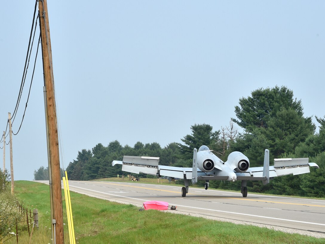 An A-10 Thunderbolt II pilot, 127th Wing, Selfridge Air National Guard Base, taxis down a pubic highway after landing here, August 5, 2021. The training event marked the first time in U.S. history that a modern military aircraft landed on a U.S. public highway designed only for automobiles.