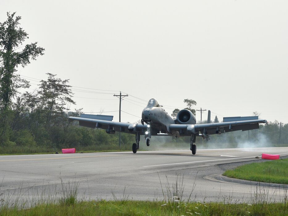 An A-10 Thunderbolt II pilot, 127th Wing, Selfridge Air National Guard Base, touches down on a pubic highway here, August 5, 2021. The training event marked the first time in U.S. history that a modern military aircraft landed on a U.S. public highway designed only for automobiles.