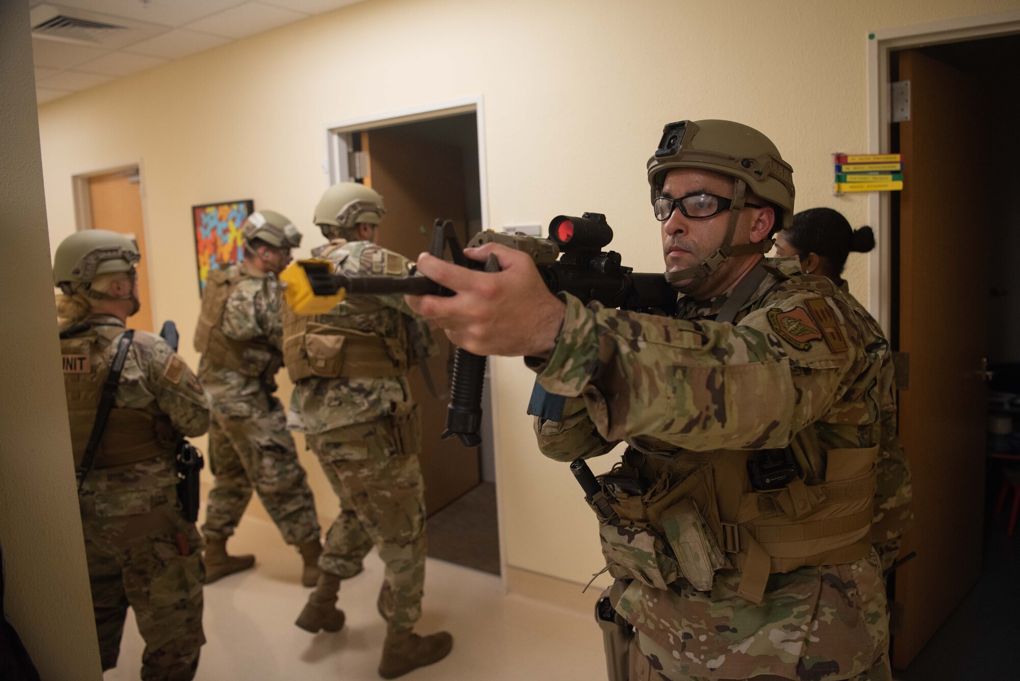 Security Forces members secure and enter a room.