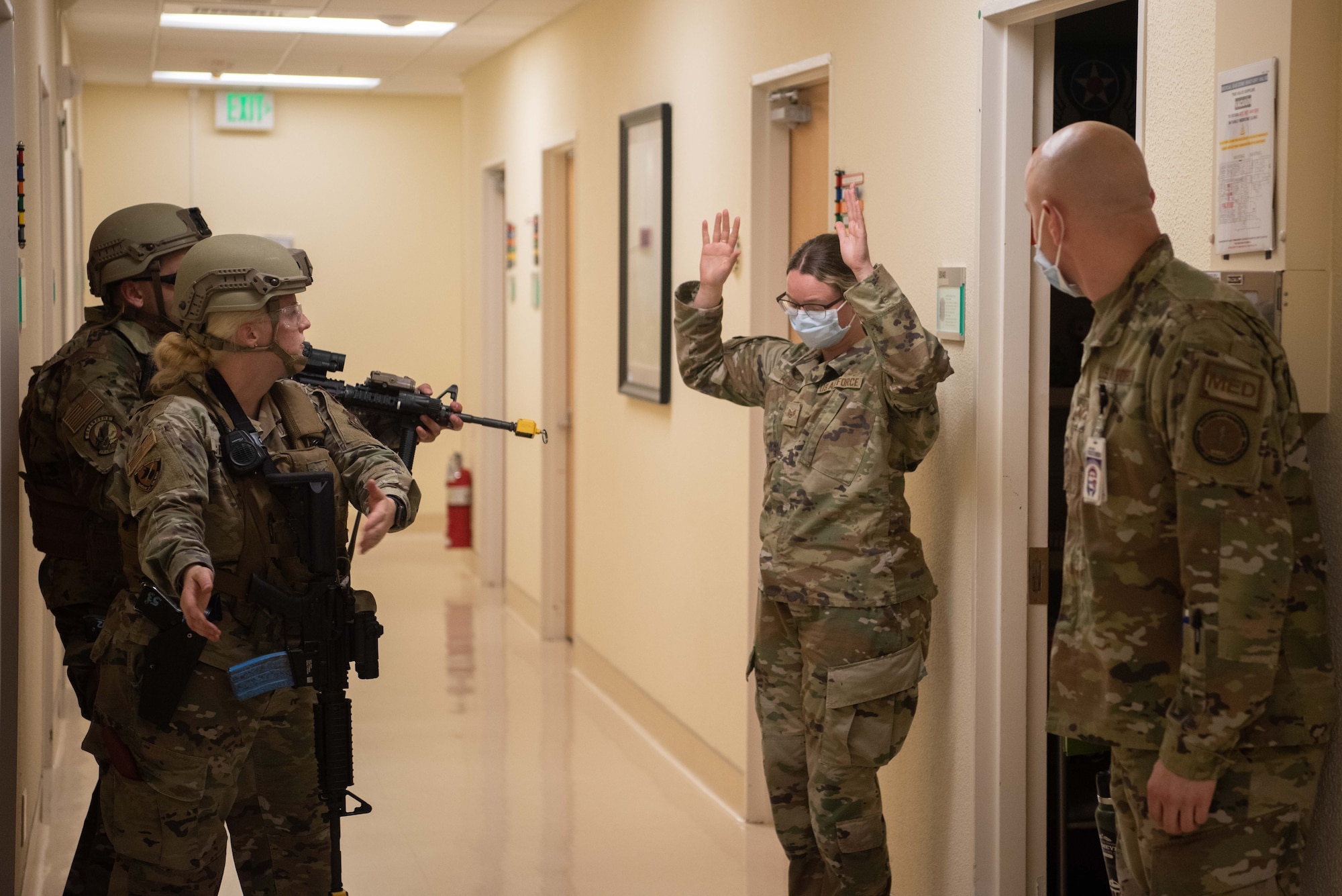 Security Forces members escort an individual from a secure location.