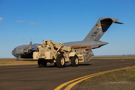 JOINT BASE ELMENDORF-RICHARDSON, Alaska -- The Alaska National Guard transports cargo for the Defense Commissary Agency from Joint Base Elmendorf-Richardson via a C-17 Globemaster III aircraft from the 176th Wing’s 144th Airlift Squadron to the remote village hub of Bethel, Alaska, Aug. 2, 2021. The AKNG partnered with DeCA in order to provide discounted groceries to eligible military- and DoD-affiliated patrons during a one-day event Aug. 7. (U.S. Army National Guard photos by 1st Lt. Balinda O’Neal Dresel)