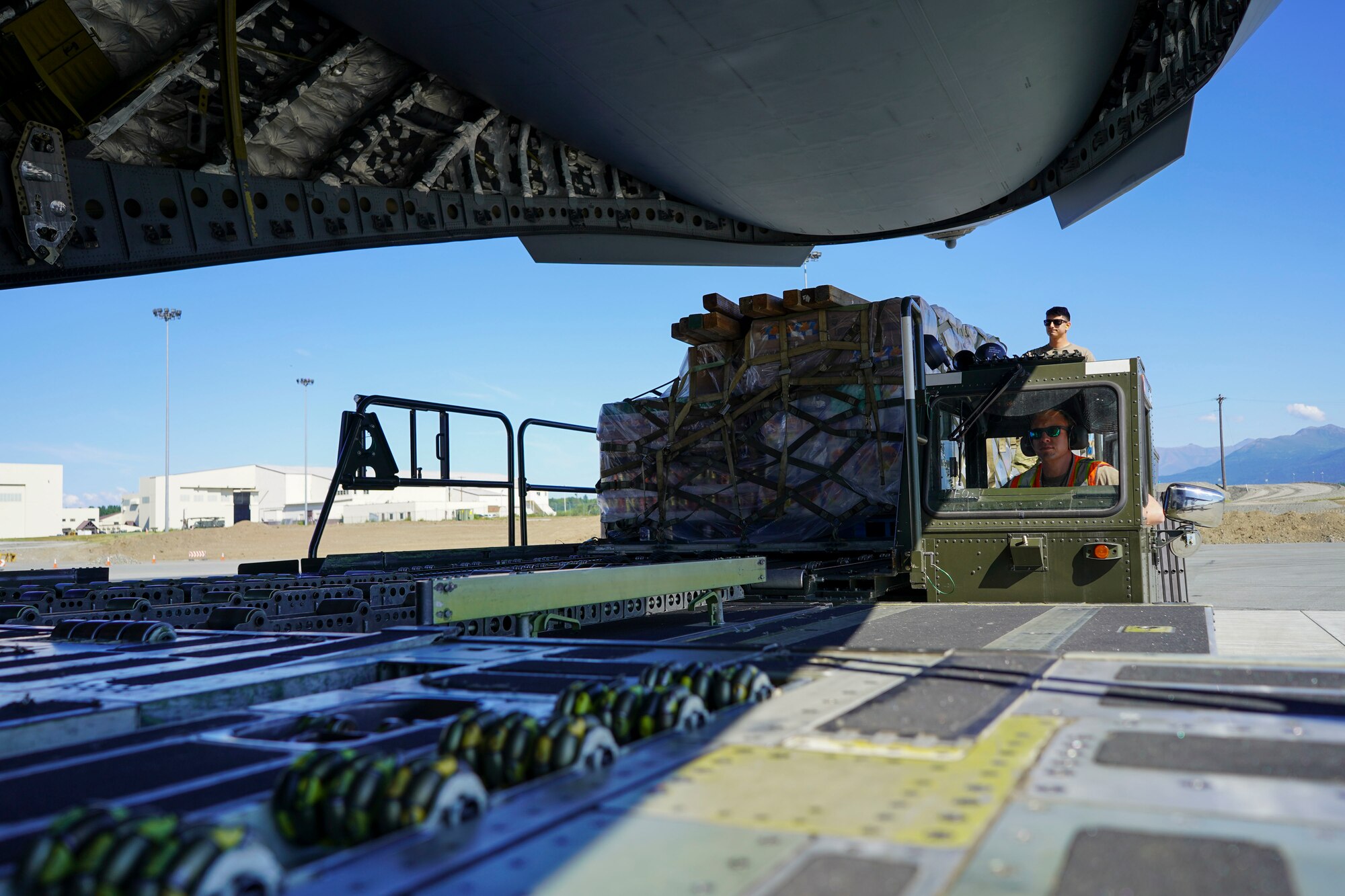 JOINT BASE ELMENDORF-RICHARDSON, Alaska -- The Alaska National Guard transports cargo for the Defense Commissary Agency from Joint Base Elmendorf-Richardson via a C-17 Globemaster III aircraft from the 176th Wing’s 144th Airlift Squadron to the remote village hub of Bethel, Alaska, Aug. 2, 2021. The AKNG partnered with DeCA in order to provide discounted groceries to eligible military- and DoD-affiliated patrons during a one-day event Aug. 7. (U.S. Army National Guard photos by 1st Lt. Balinda O’Neal Dresel)